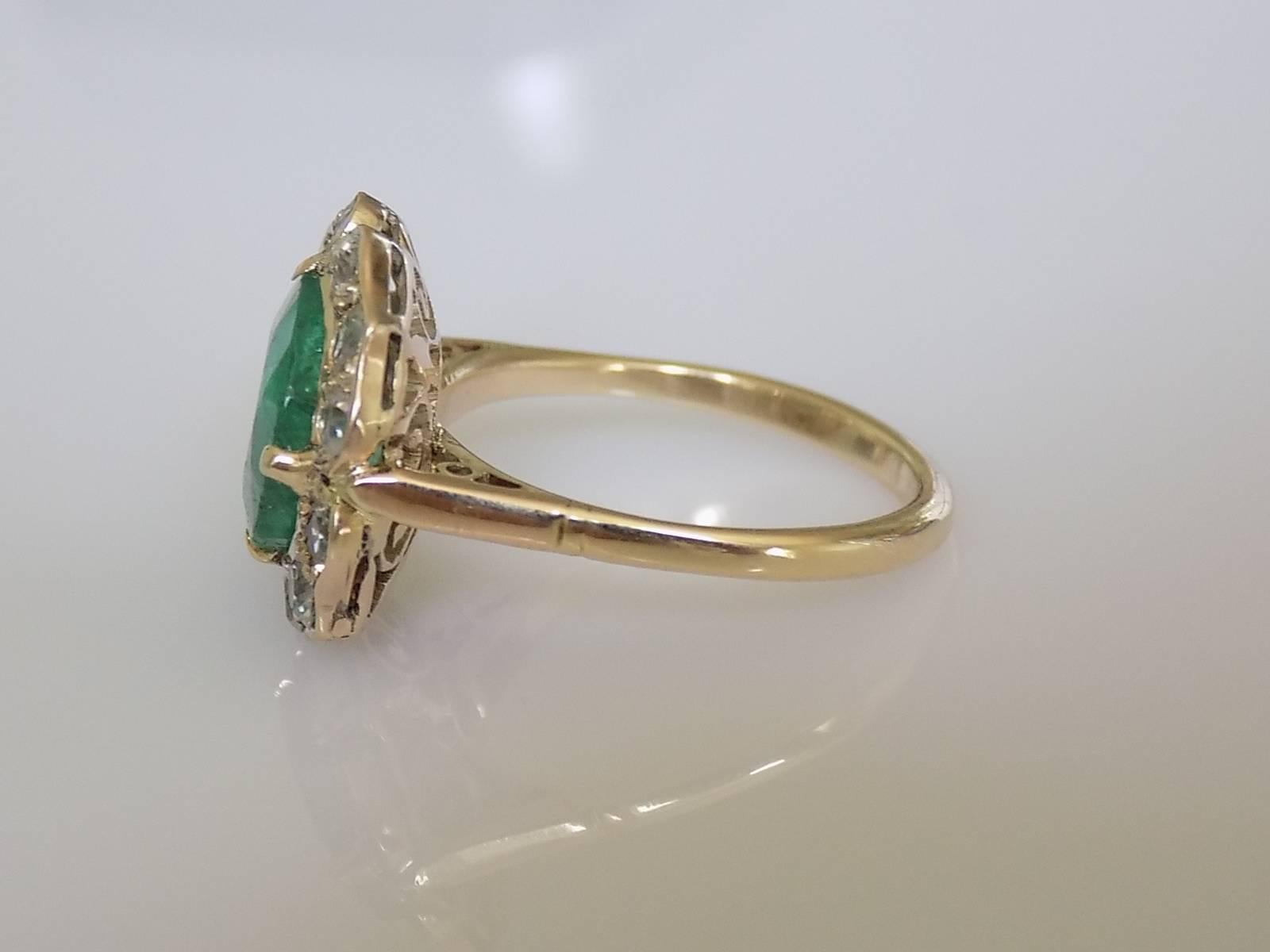An Outstanding Victorian c.1890-1900 Yellow Gold and Impressive 3 Carat Natural Emerald ring. Emerald surrounded by hand cut white Zircons in Gorgeous Flower shaped setting. Looks Spectacular when worn. English origin.

Size N 1/2 UK, 7.25