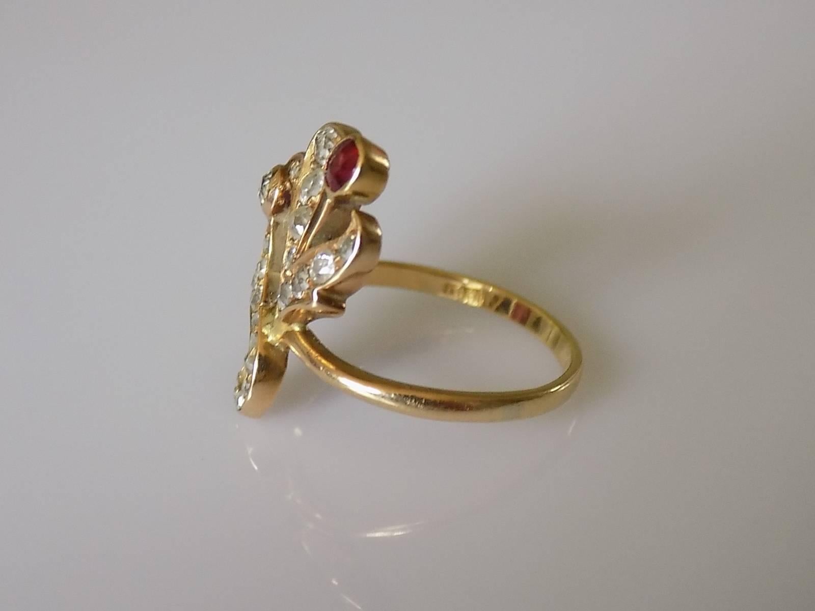 A Gorgeous Art Nouveau c.1890 18 Carat Yellow Gold, Old cut Diamond and Garnet ring. The ring outstanding quality and made in traditional Art Nouveau style with a very soft organic lines in the shape of a flower and leaves. Unique and extremely