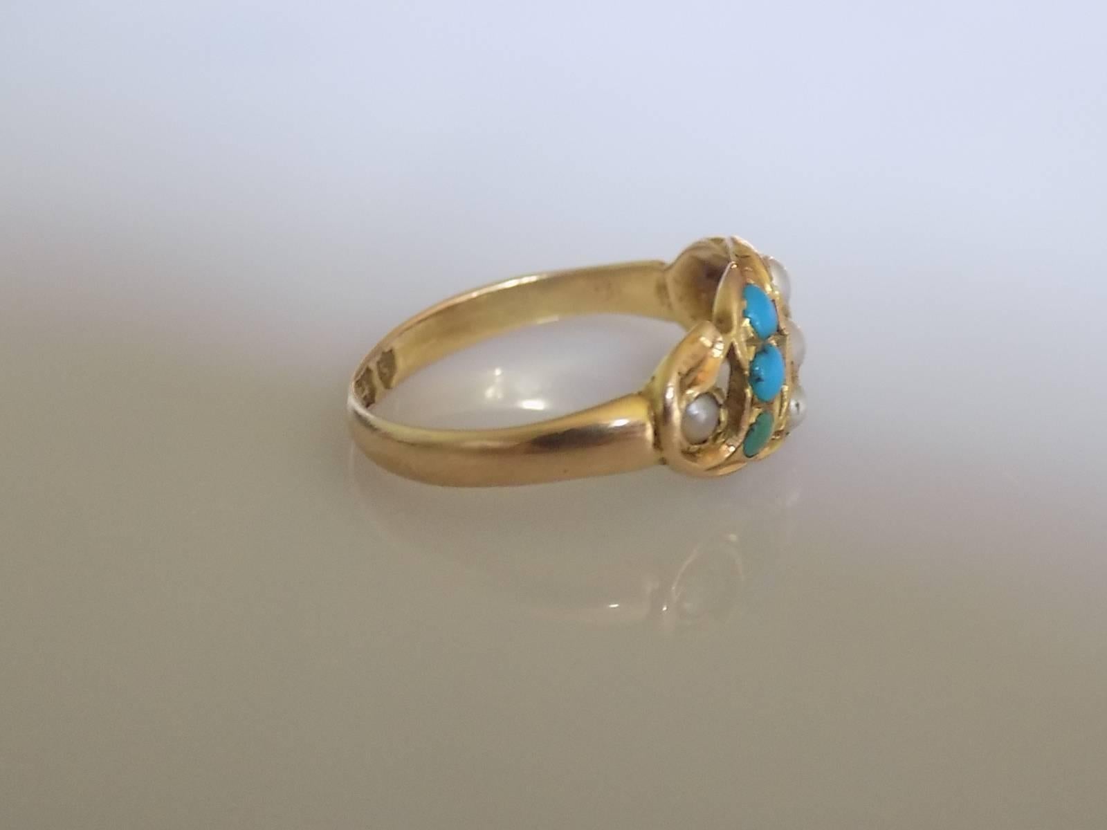 A Lovely Victorian c.1893 15 Carat Rose Gold, split seed Pearl and Turquoise ring. English Origin.

Size J 1/2 UK, 5 US.

Height of the face 9mm. 

Weight 2.1gr.

Full Birmingham hallmark for 15 Carat Gold.

Ring fully complete with a