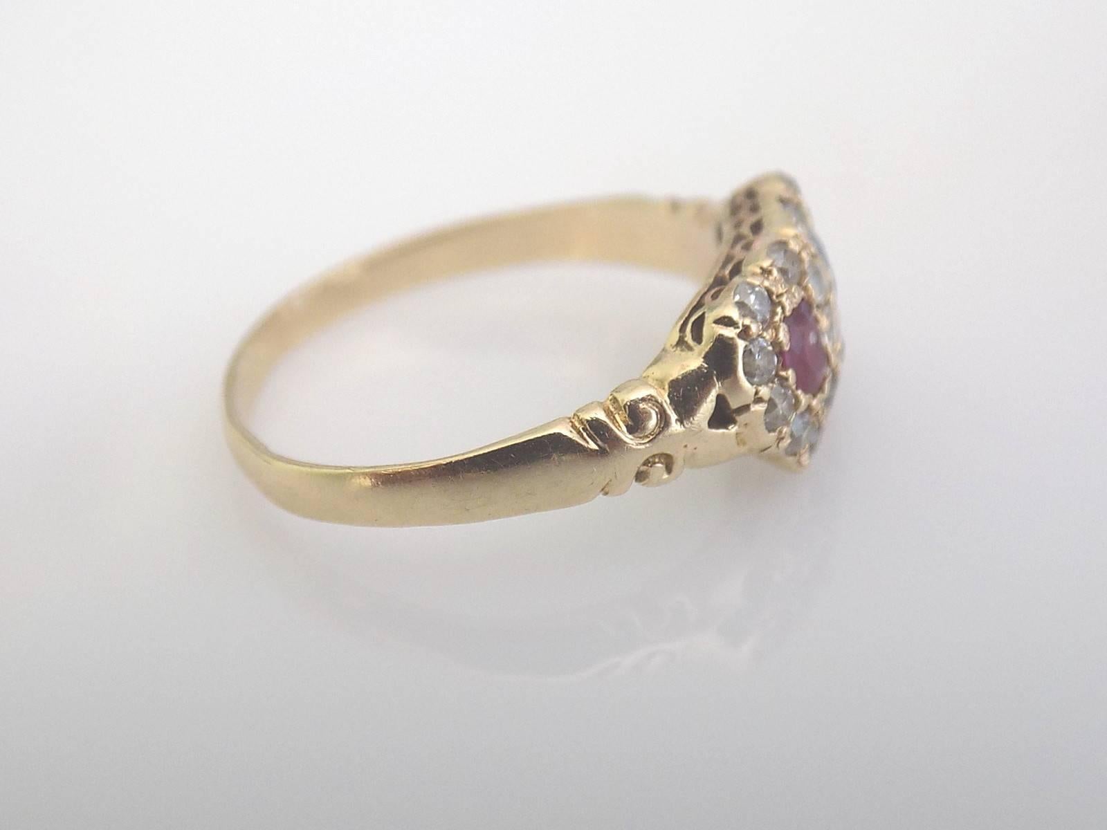 A Lovely Antique Victorian 15 carat gold, Ruby, Sapphire and Diamond Double Heart love ring on fancy shoulders. English Origin. 
Size L 1/2 UK, 5.75 US.
Height of the face 7mm. 
Weight 1.8gr.
Marked 15CT for 15 Carat Gold.

