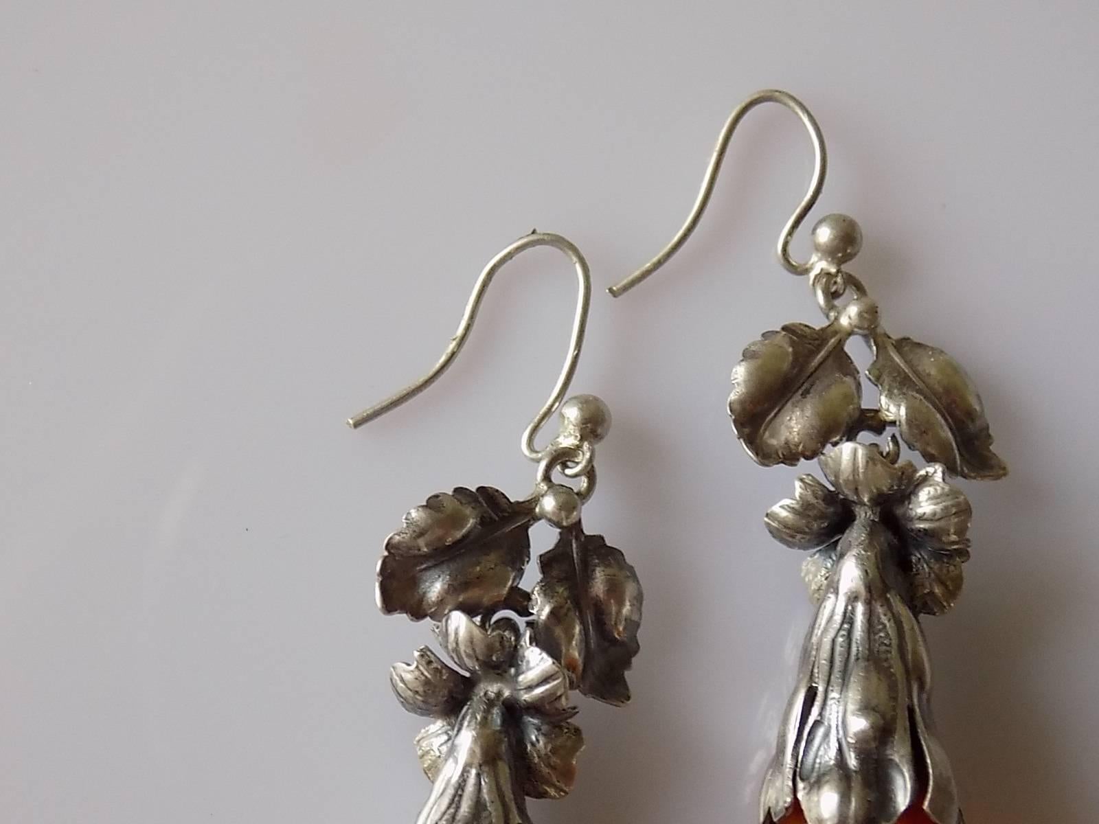 
One Of A Kind Art Nouveau c.1900 solid Silver and Scottish Agate pendant earrings. The earrings fully hand crafted and designed in shape of flowers and leaves suspending a large Agate drop. Art Nouveau jewellery not like not one other period they
