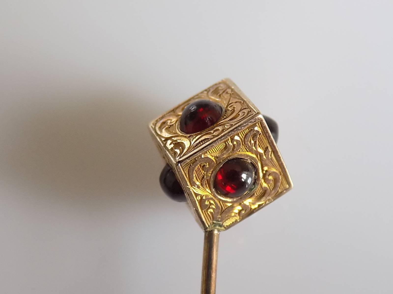 An Extremely Rare and Unusual Victorian finely engraved 15 Carat Gold and Garnet cabochon Dice or Cube stick pin by John Bennett. In original John Bennett 65&64. Cheapside London case. English Origin.
Length 74mm, Height of the top 12mm.
Weight