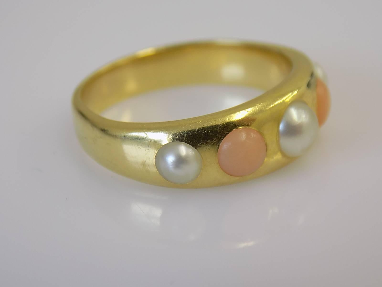 An Outstanding quality Victorian c.1880 18 Carat Yellow gold, Coral and half pearl ring. English origin.
Size O 1/2 UK, 7.5 US.
Height of the face 6mm.
Weight 7.4gr.
Marked: JW-maker,  18 for 18 Carat Gold.