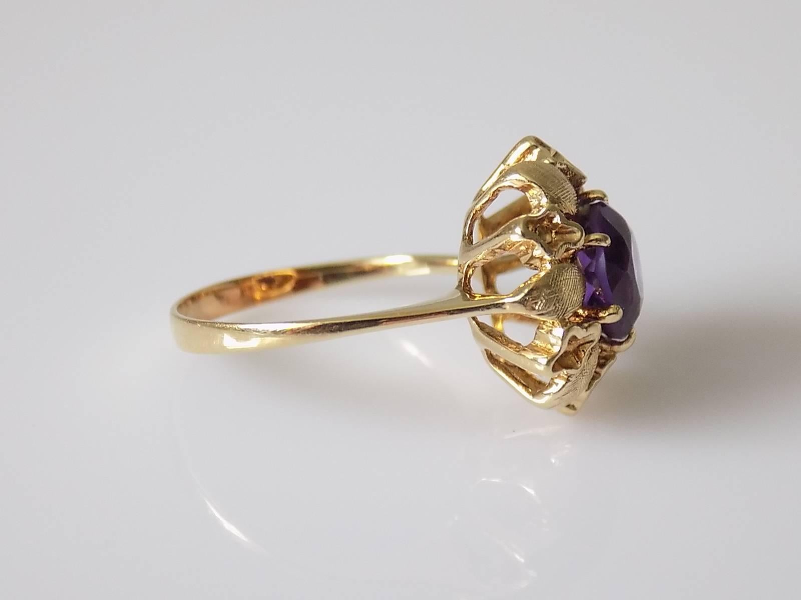 A lovely Vintage c.1950s 14 Carat Gold and Amethyst flower designed solitaire ring.
Size L 1/2 UK, 6.25 US
Height of the face 15mm.
Amethyst 7mm.
Weight 3.4gr.
Unmarked, tested 14 Carat Gold.