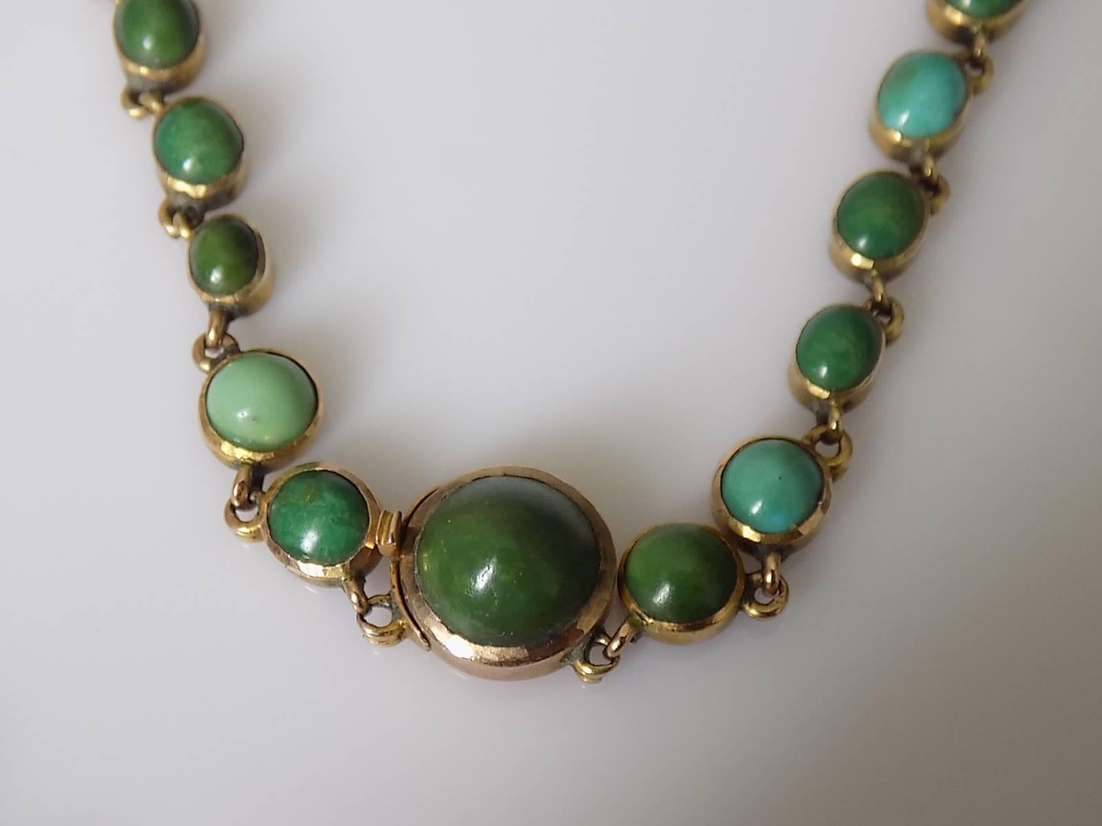 A Gorgeous Antique Victorian c.1860s 15 Carat Gold and Turquoise Riviere necklace. Turquoise mounted in open back setting. The color of Turquoise vary from light blue to dark green showing real charm and age of the necklace. English origin.
Length