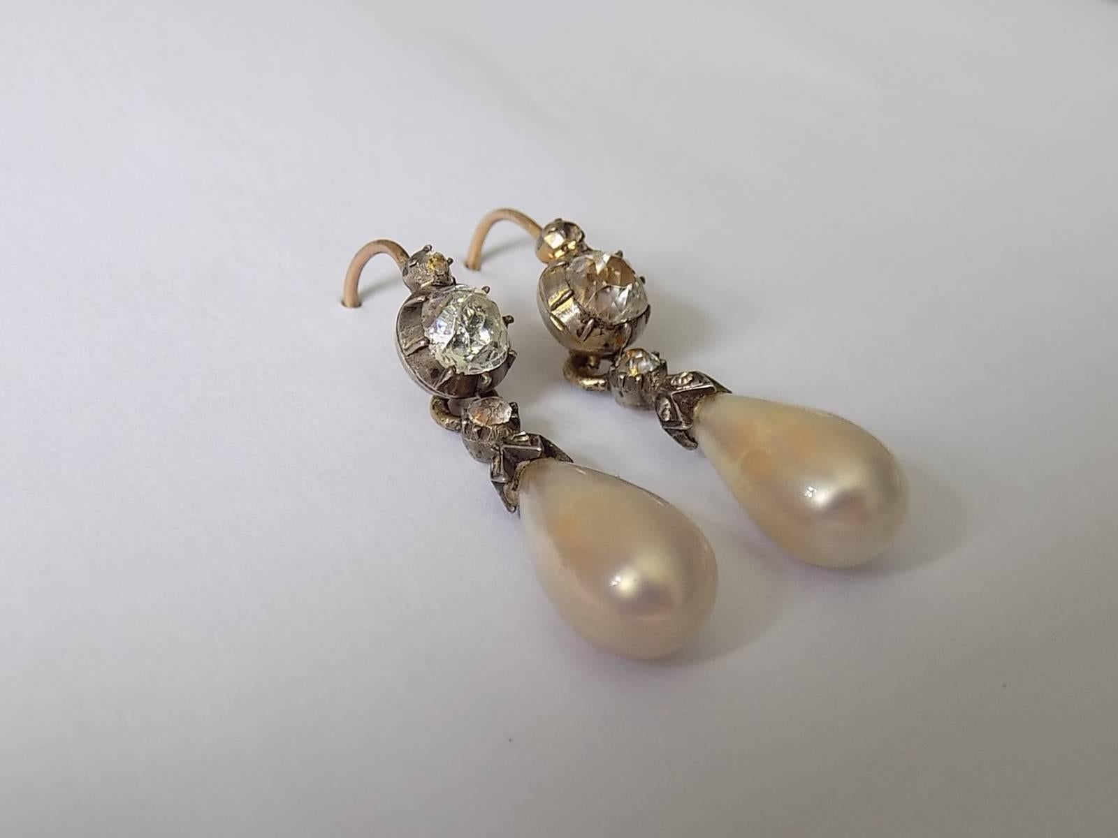 A Beautiful Antique Georgian c.1700s Yellow Gold, Silver and hand cut foil backed in closed back setting Paste drop earrings. The Pearl drops made of blown glass coated in nacre made from fish scale paste, giving them the effect of large natural