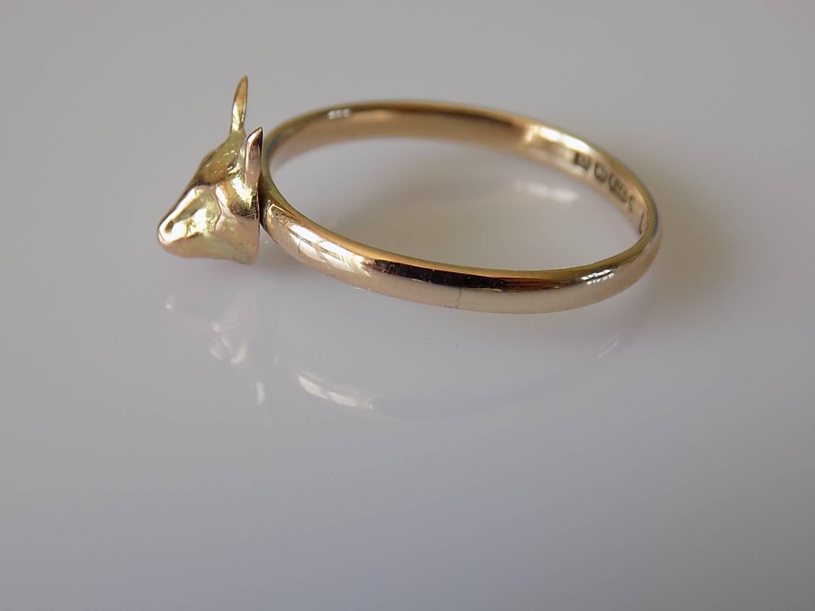 A Victorian Gold Fox head stick pin conversion ring on 9 Carat Gold shank. 
Size Q 1/2 UK, 8.75 US.
Height of the face 9mm, Width 7mm.
Weight 1.7gr.
Shank fully hallmarked for 9 Carat Gold.
Very good condition and ready to wear.