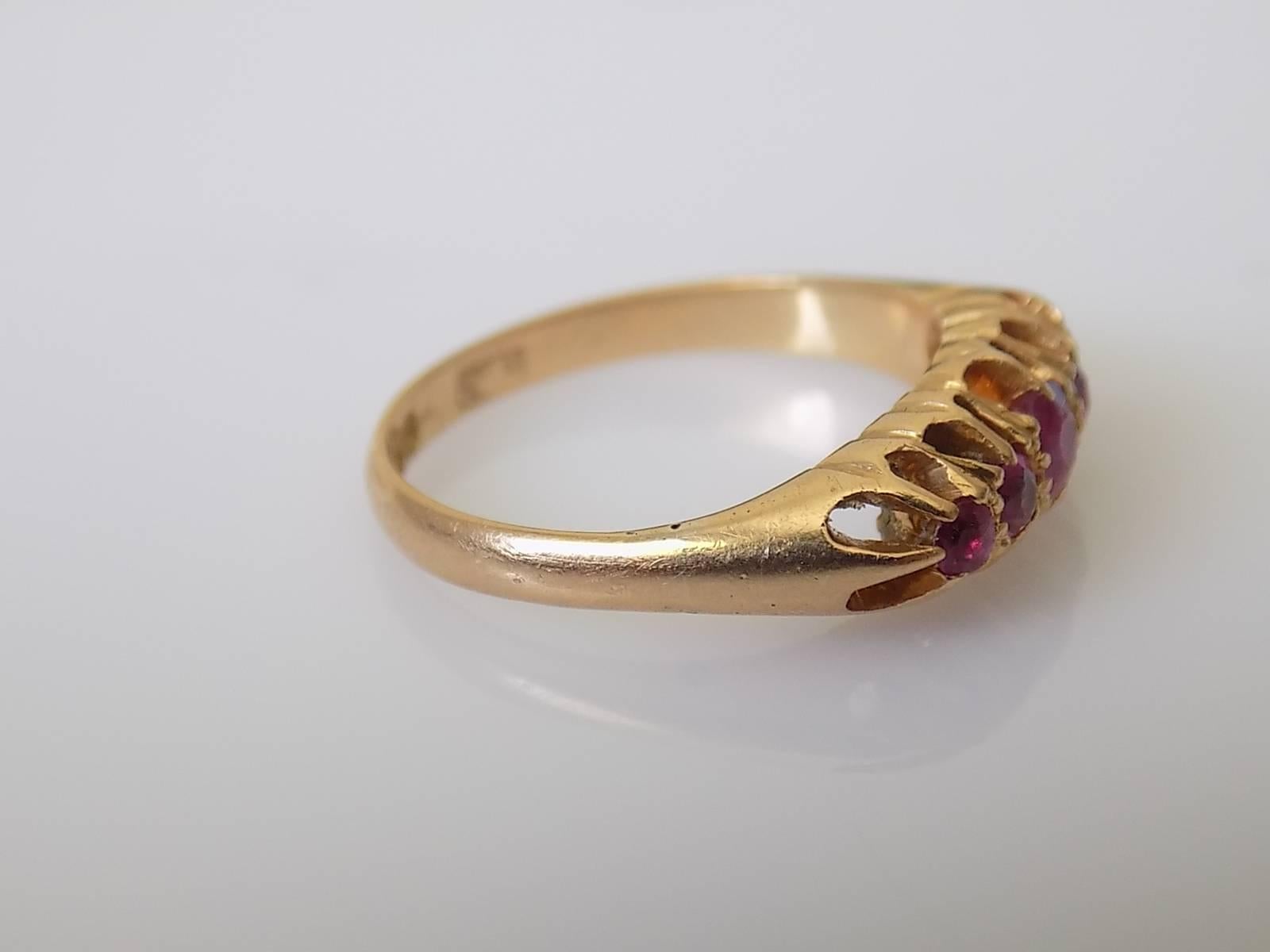 A Lovely Victorian c.1870s 18 Carat Gold and five Ruby ring. English origin.
Size K 1/2 UK, 5.5 US (sizeable).
Height of the face 5mm.
Rubies from 2mm to 3.2mm
Weight 3.1gr.
Full London hallmark for 18 carat gold.
The ring in very good condition.