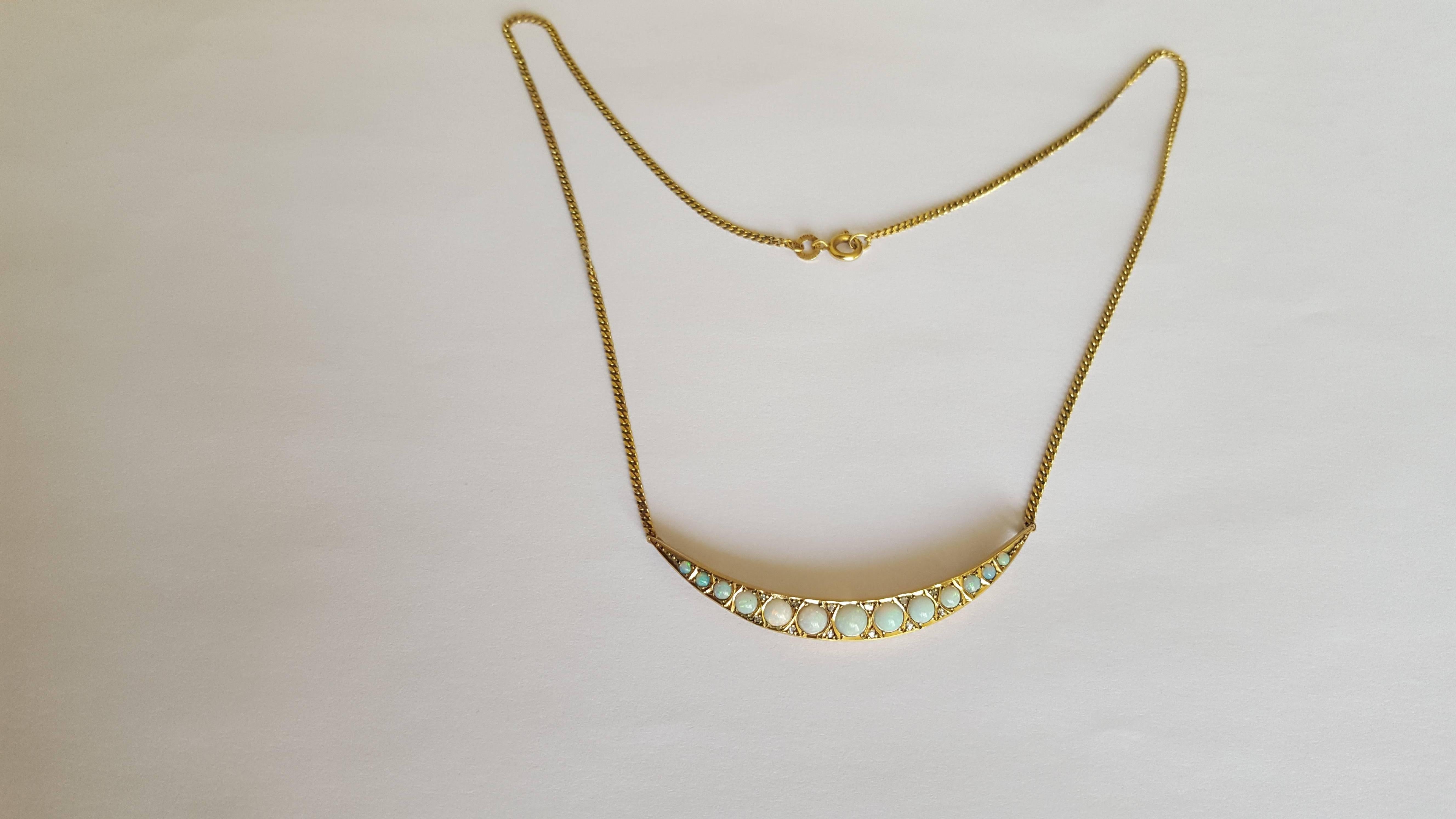 A Beautiful Antique Victorian 9 Carat Gold, Opal and Diamond crescent necklace brooch conversion on later 9 Carat Gold chain. 
Total length of the necklace 15 3/4"
Crescent 2".
Crescent and chain hallmarked for 9 Carat Gold. 