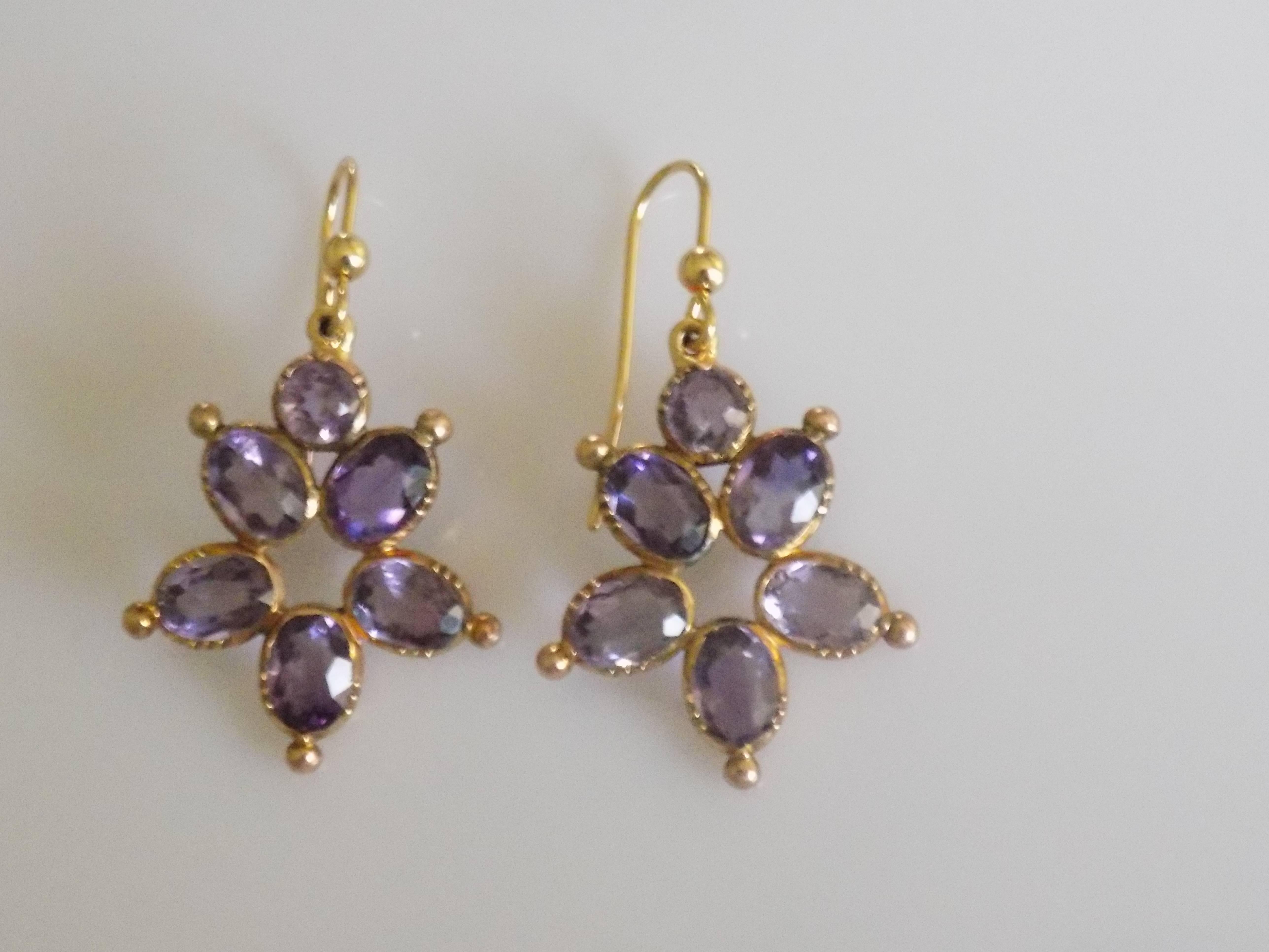 An Impressive Antique Victorian 18 Karat Gold and Amethyst drop earrings. The earrings complete with a brand new hook wires for pierced ears.
Total drop including hooks 38mm, width 22mm.
Weight 6.7gr.
Earrings unmarked, tested for 18 Karat Gold.