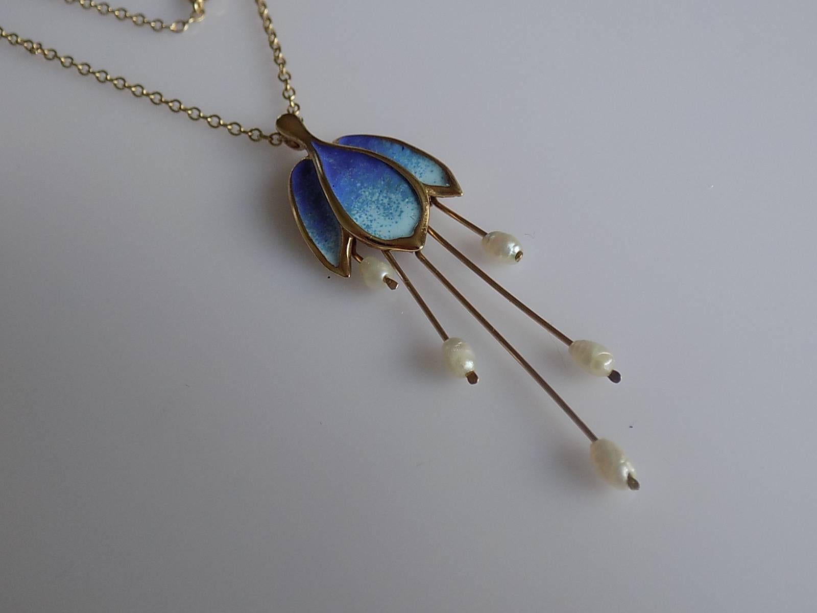 A Gorgeous and Rare Vintage 9 Carat Gold, blue enamel and Pearl Fuchsia pendant by Norman Grant. The pendant complete with a 9 Carat Gold chain. English origin.
Pendant 56mm x 16mm.
Length of the chain 16 1/2".
Fully hallmarked for 9 Carat Gold