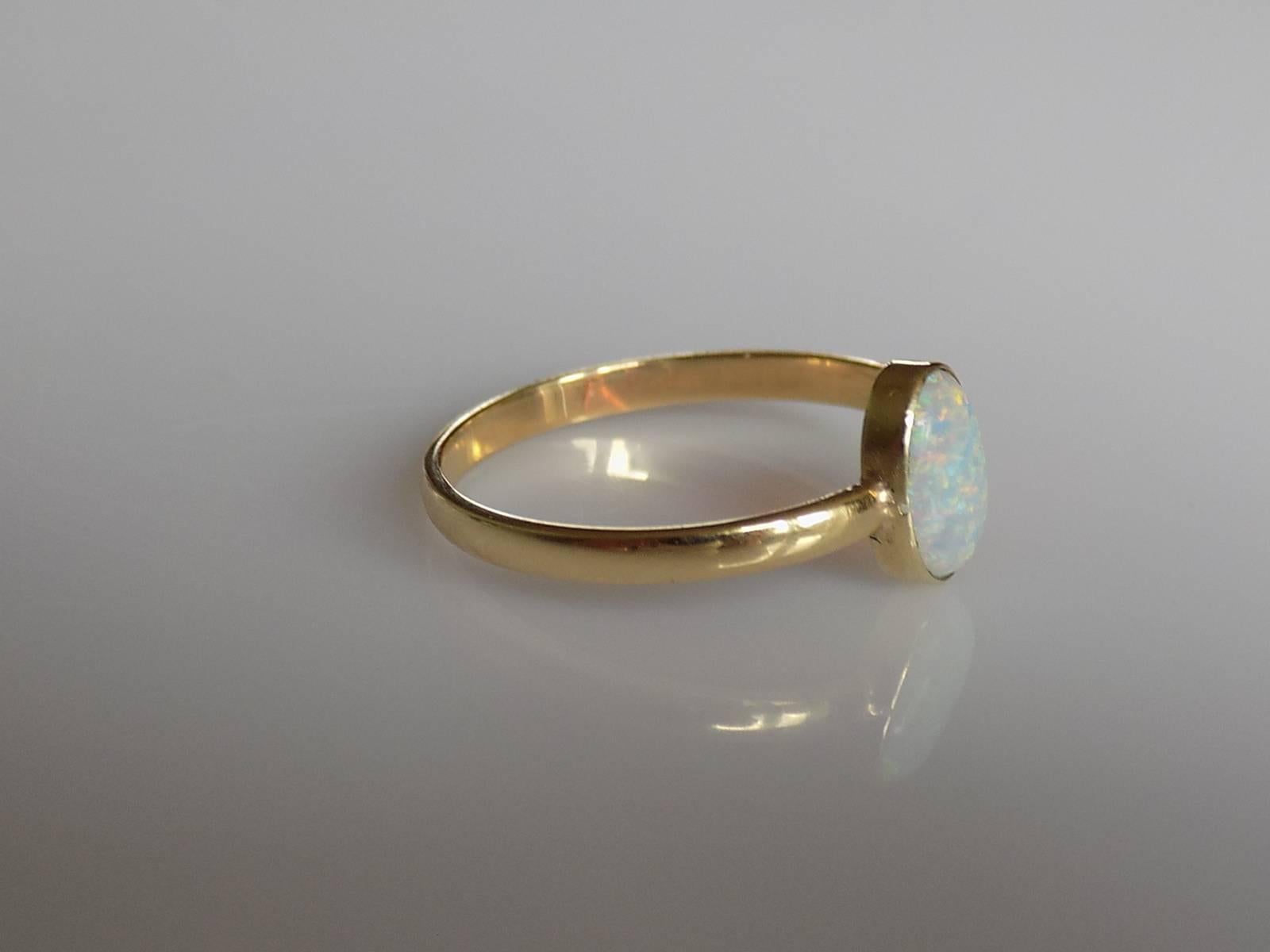 A Beautiful Victorian Australian Opal stick pin conversion ring on a later 18 Carat Gold shank. Perfect as everyday ring. English origin.
Size Q 1/2 UK, 8.75 US can be sized.
Opal 9mm x 6mm.
Weight 1.9gr.
London hallmark for 18 Carat Gold.
The ring