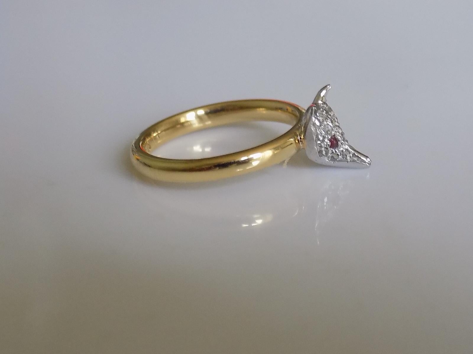 A Cute Victorian Silver, Rose cut Diamonds and Ruby Fox head stick pin conversion ring on 18 Carat Gold shank. 

Size M UK, 6.5 US.

Height of the face 10mm, Width 8mm.

Weight 6.0gr.

Shank fully hallmarked for 18 Carat Gold.