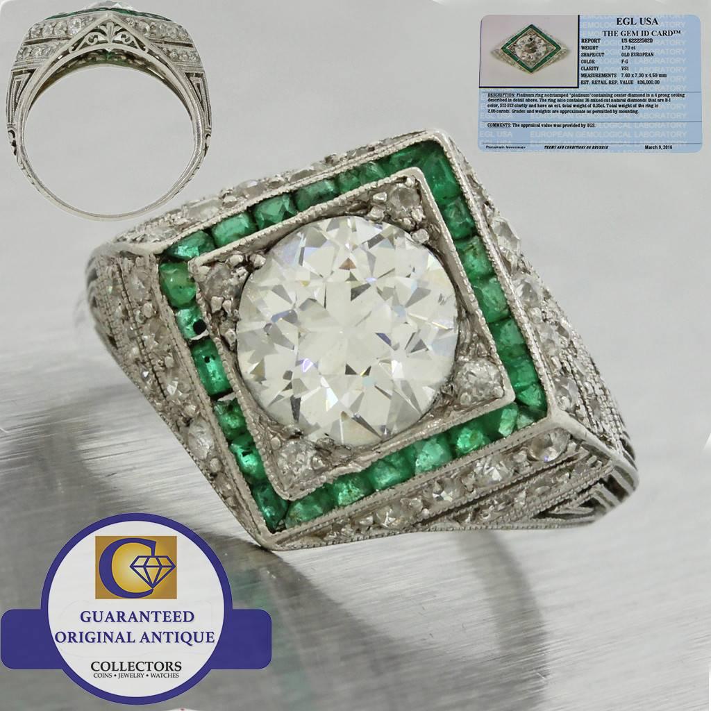 This is an antique Art Deco platinum filigree diamond and emerald engagement ring that can be dated back to the 1920s. This rings center diamond was graded by world-renowned EGL USA; one of the most reputable diamond grading organizations in the