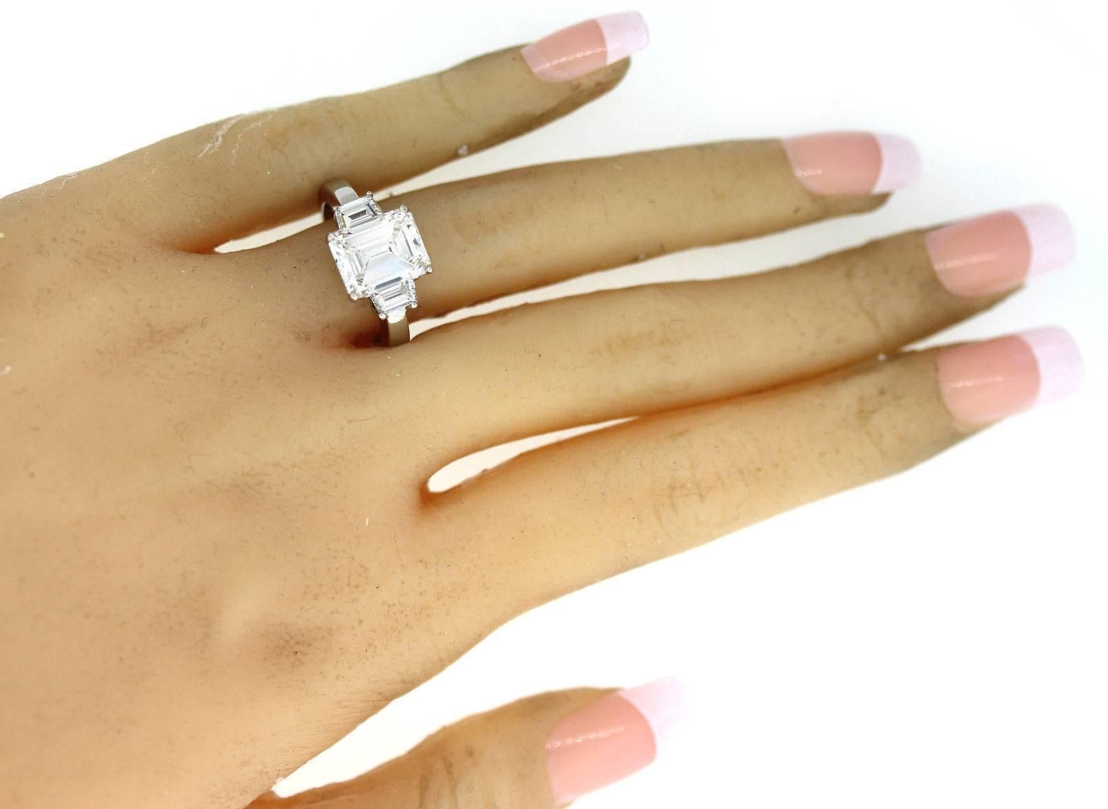 Gorgeous 3.90 carat GIA Emerald Cut Diamond Platinum 3 Stone Engagement Ring For Sale 2