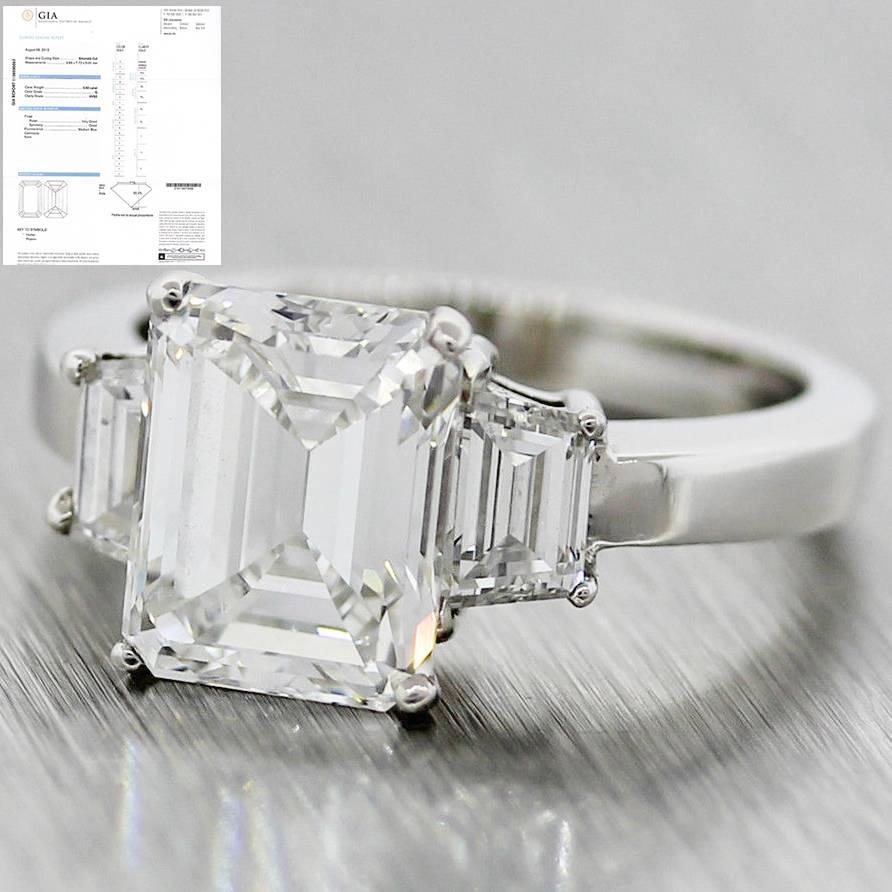 This is a beautiful one of a kind  3 stone emerald cut diamond engagement ring crafted in platinum that has been certified by GIA; one the most reputable gem grading organizations in the world. The ring is a size 5.75, and is also re-sizeable. It