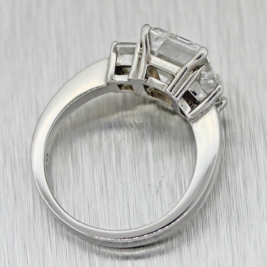 Women's Gorgeous 3.90 carat GIA Emerald Cut Diamond Platinum 3 Stone Engagement Ring For Sale