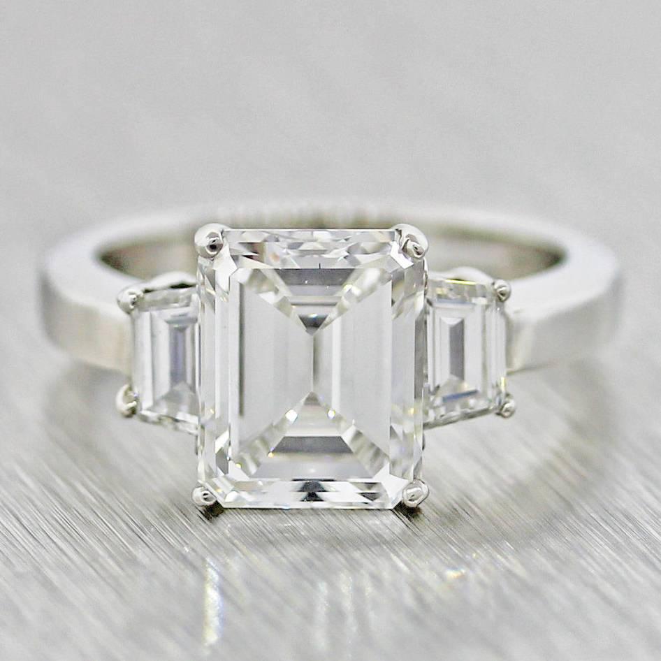 Modern Gorgeous 3.90 carat GIA Emerald Cut Diamond Platinum 3 Stone Engagement Ring For Sale