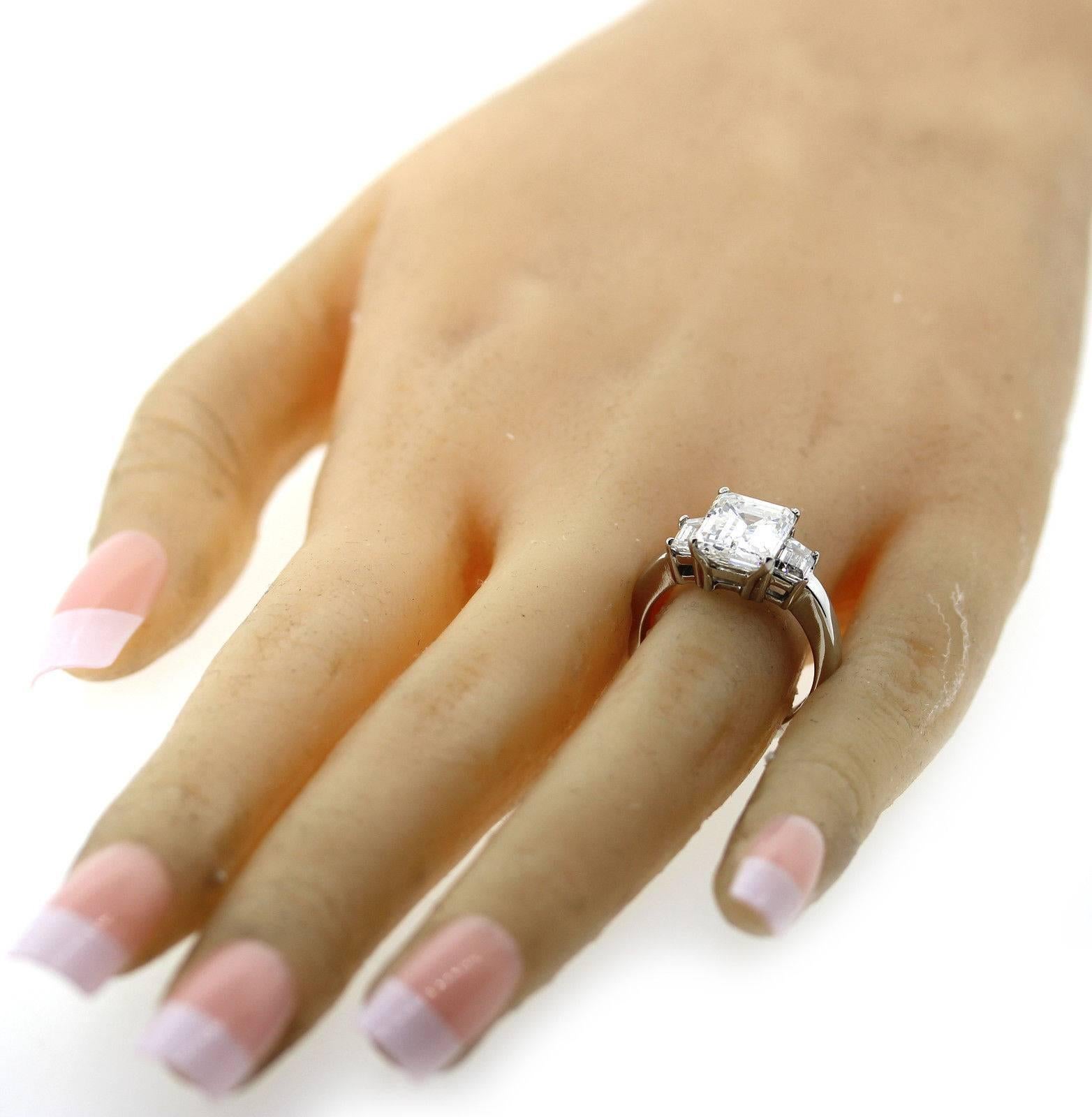 Gorgeous 3.90 carat GIA Emerald Cut Diamond Platinum 3 Stone Engagement Ring For Sale 3