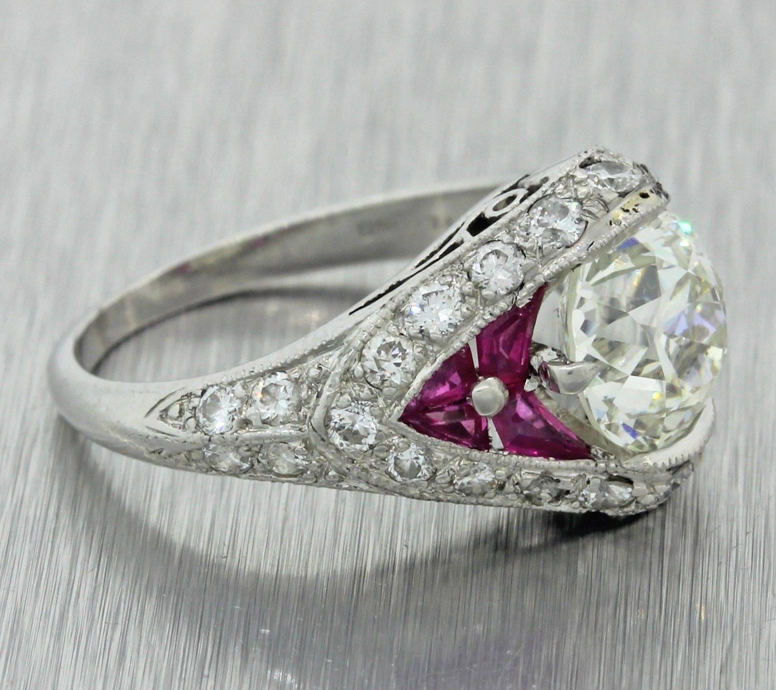 This is a beautiful 1920s Antique Art Deco Solid Platinum 2.53ctw Diamond Ruby Engagement Ring EGL. The ring has been certified by E GL, one of the world's leaders in diamond grading. The MSRP is $22,000.00.  It will come in a lovely ring box for a