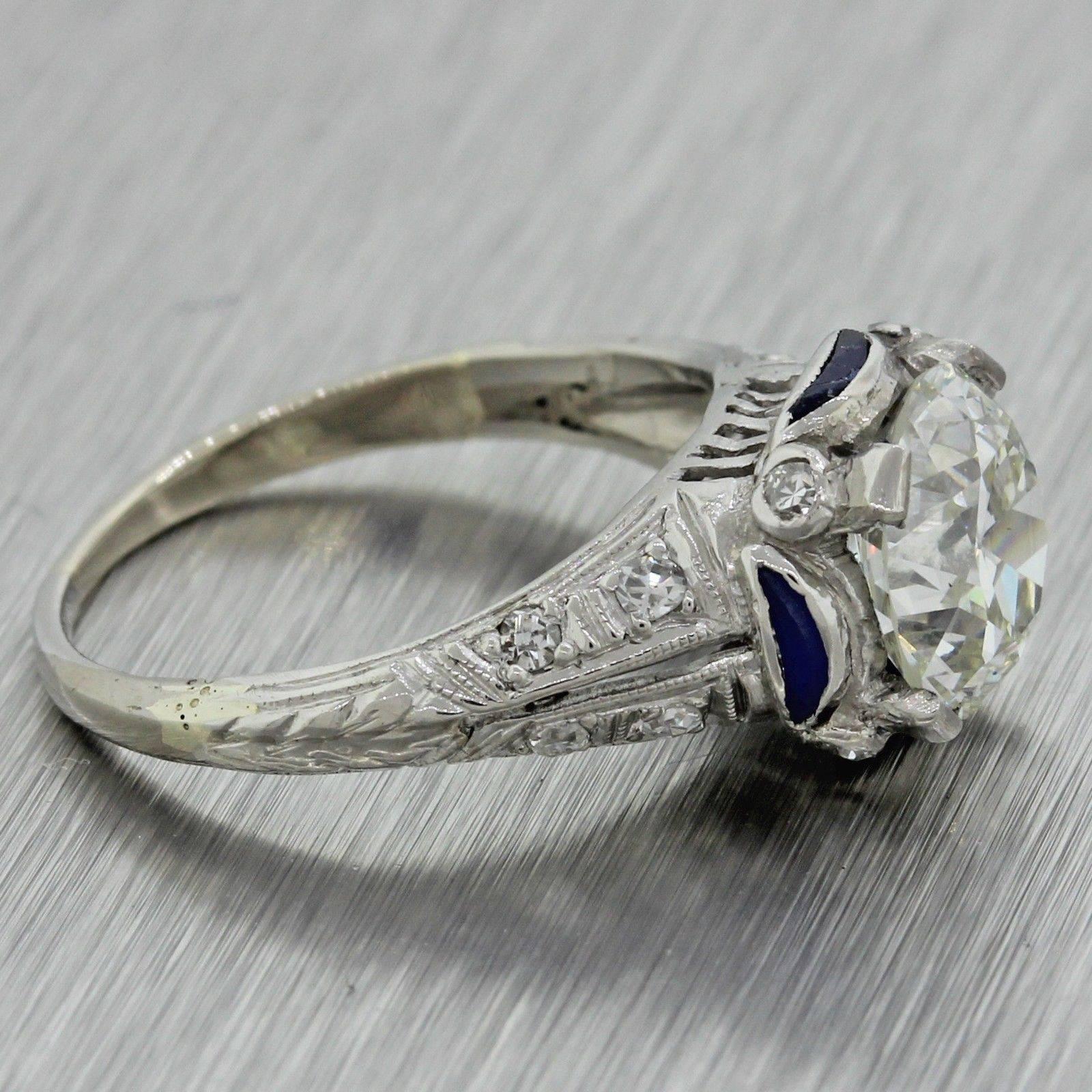 This is another gorgeous and stunning antique art deco platinum diamond and sapphire engagement ring that can dated back to the 1920's. This engagement ring's center stone was graded by GIA; one of the most reputable diamond grading organizations in
