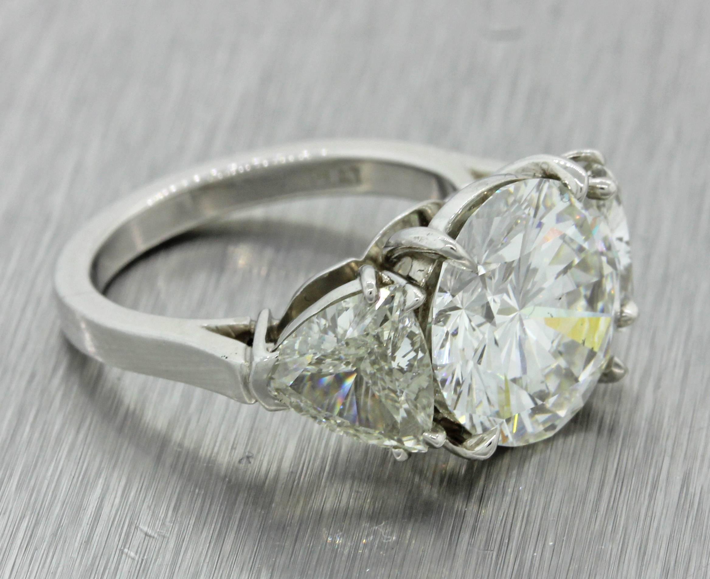 This is a gorgeous Modern Estate Platinum 7.31ctw Round Trillion Cut Three Stone GIA Diamond Engagement Ring. All 3 stones come with GIA diamond grading reports. This piece will come in a lovely ring box for a perfect presentation and our