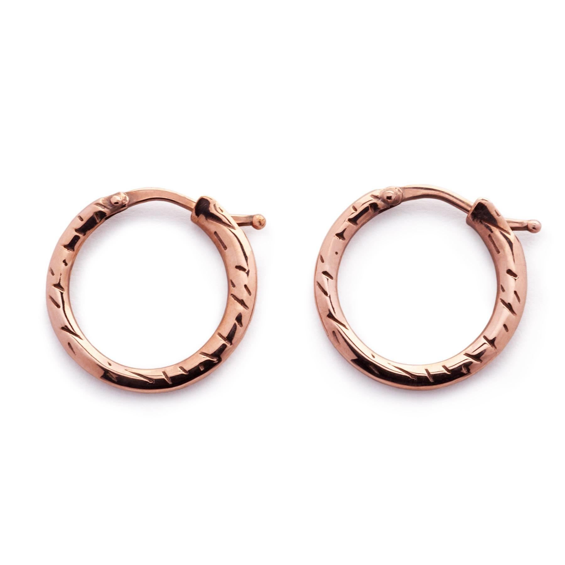 18ct rose gold hoop earrings with fur texture engraving
Hoop diameter 17mm
Made in London

Classic hoop earrings in our signature fur engraving that have a strong hint of individuality. These hoops can be worn with any piece from the collection.