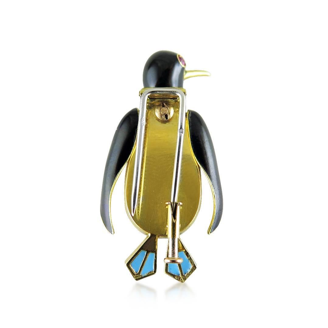 The formally dressed penguin, with articulated head, decorated with black and turquoise enamel and set with circular-cut rubies, French marks