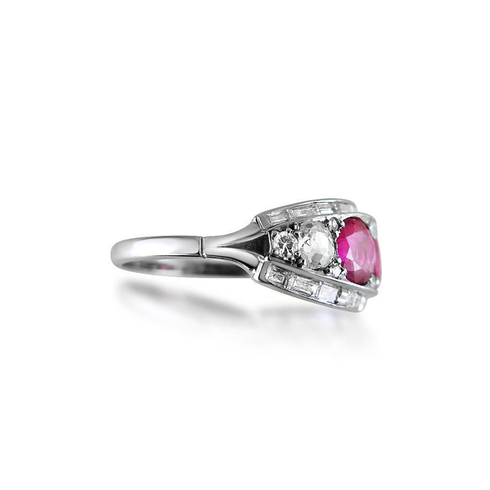 Set with three circular-cut rubies between lines of baguette diamonds, old mine-cut diamond detail, mounted in platinum, rubies weighing approximately 1.75cts in total, size N, can be resized 