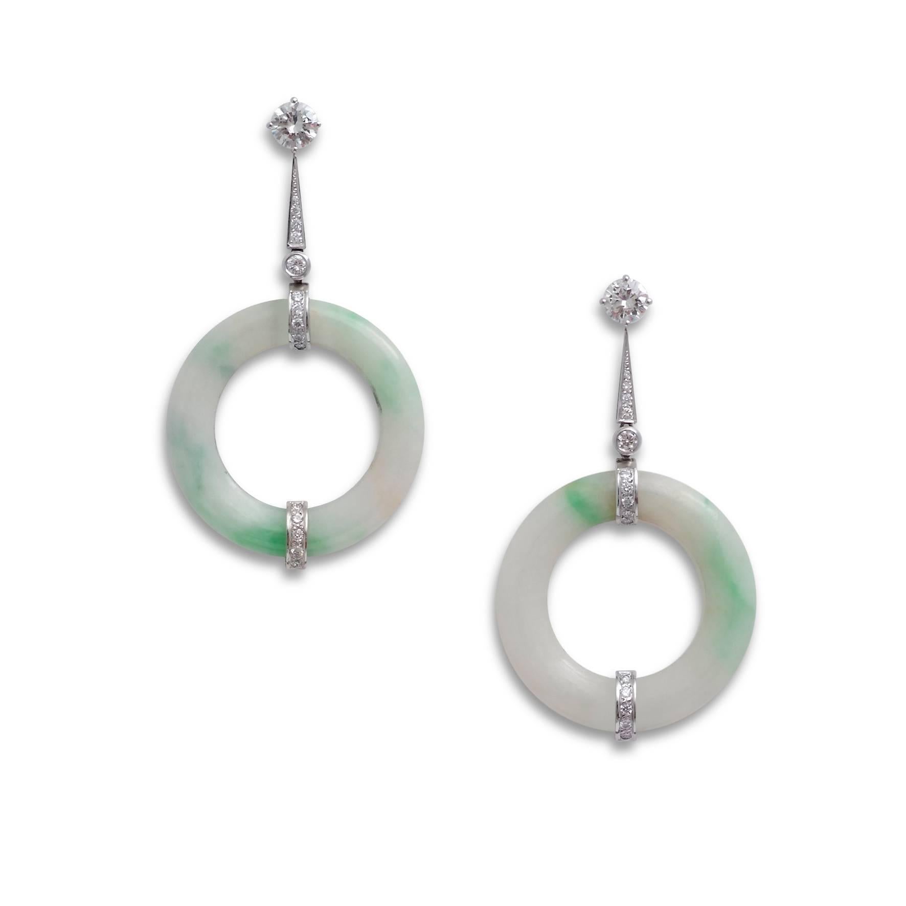 Jade disc ear-pendants with diamond terminals and detachable diamond stud tops, the two brilliant-cut diamonds weighing 0.91ct and 0.82ct respectively, mounted in 18ct white gold

Made to order