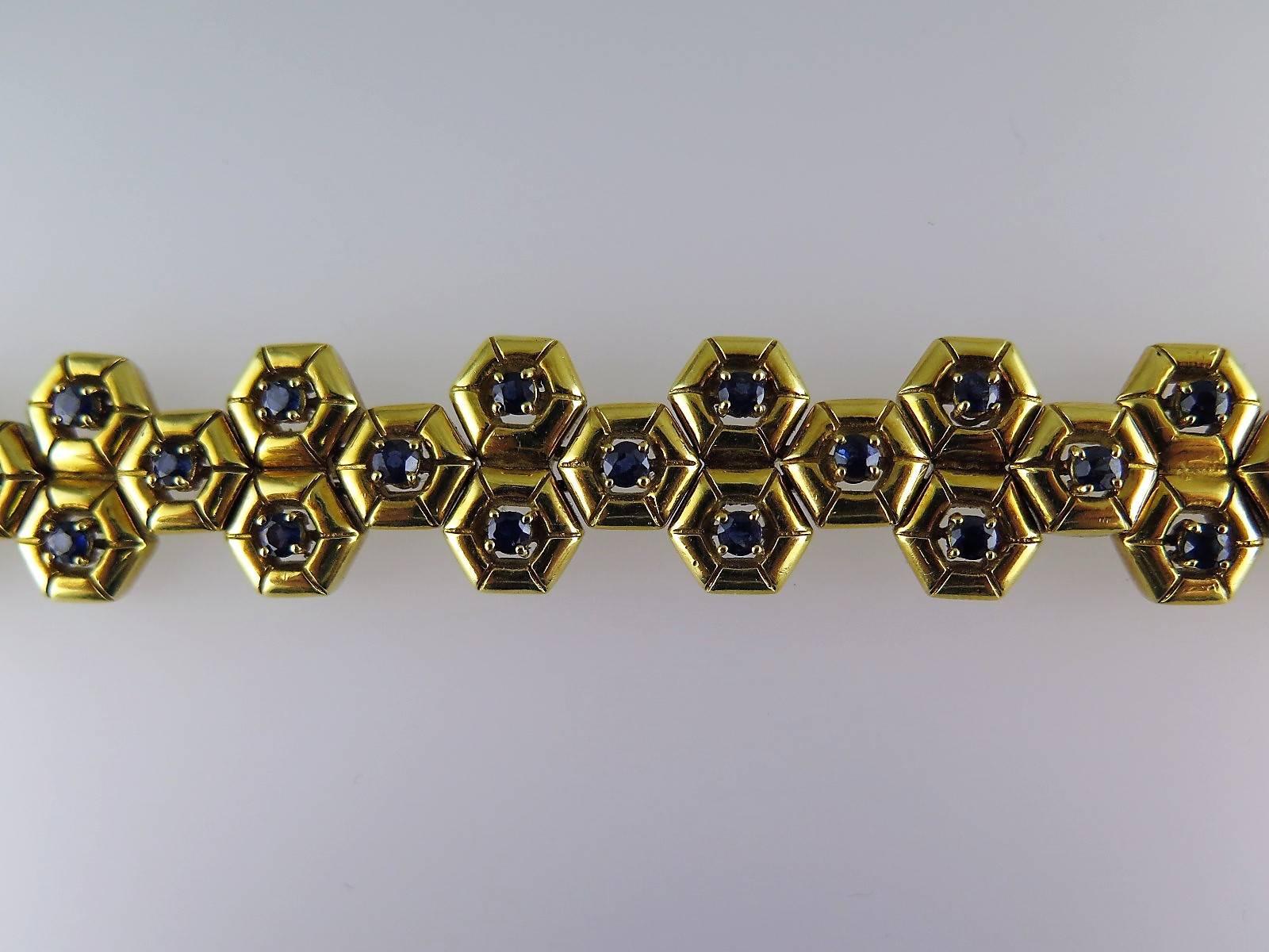Each gold hexagonal panel set to the centre with a single circular-cut sapphire, signed by Tiffany, estimated total sapphire weight approximately 5.00cts  
