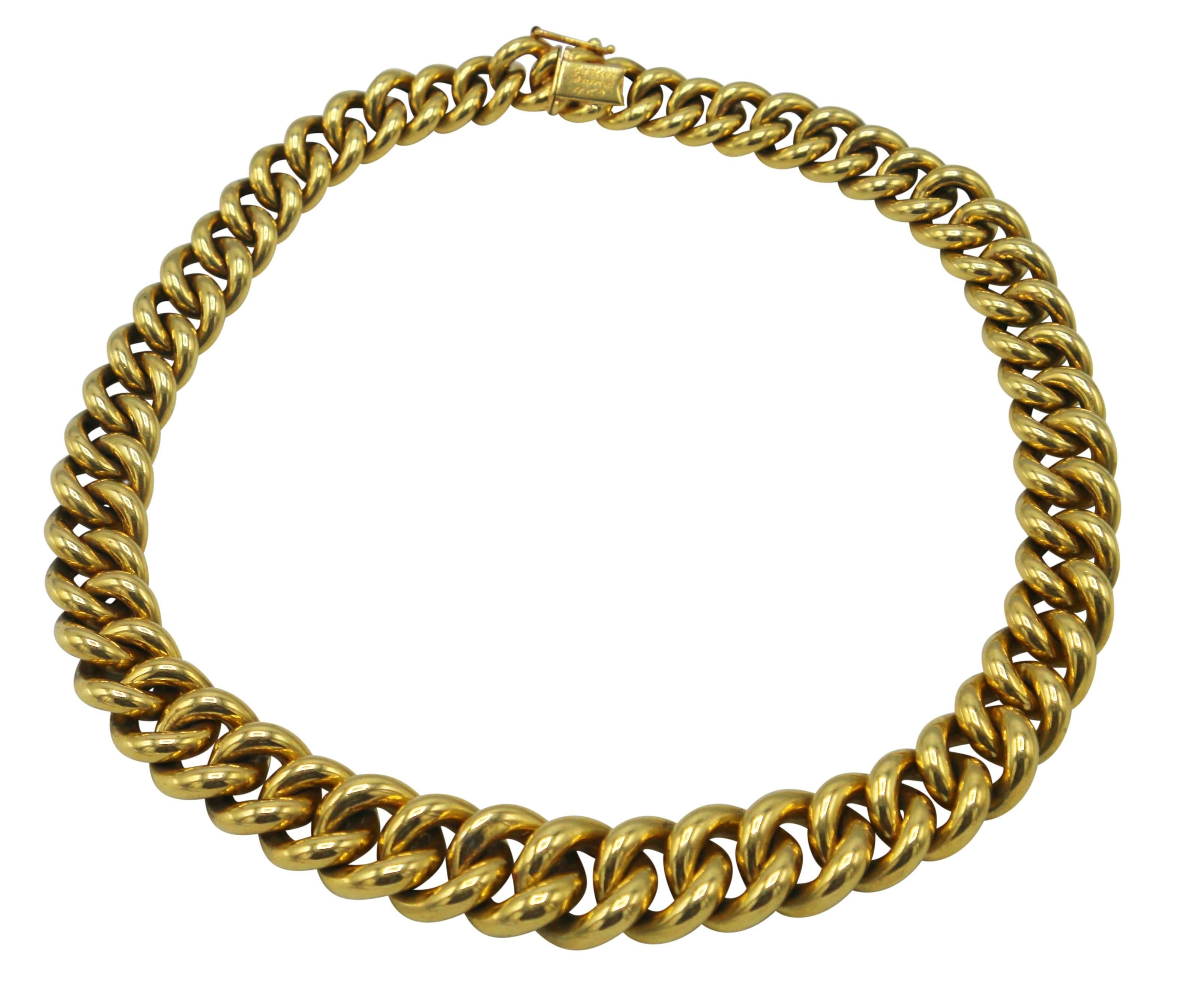 Classic 18 karat yellow gold link necklace by Cartier, France, of slightly tapered design composed of a series of polished gold links, gross weight 83.0 grams, length 14 inches, width 1/2 inch, signed Cartier, France, 18Kts. This necklace sits