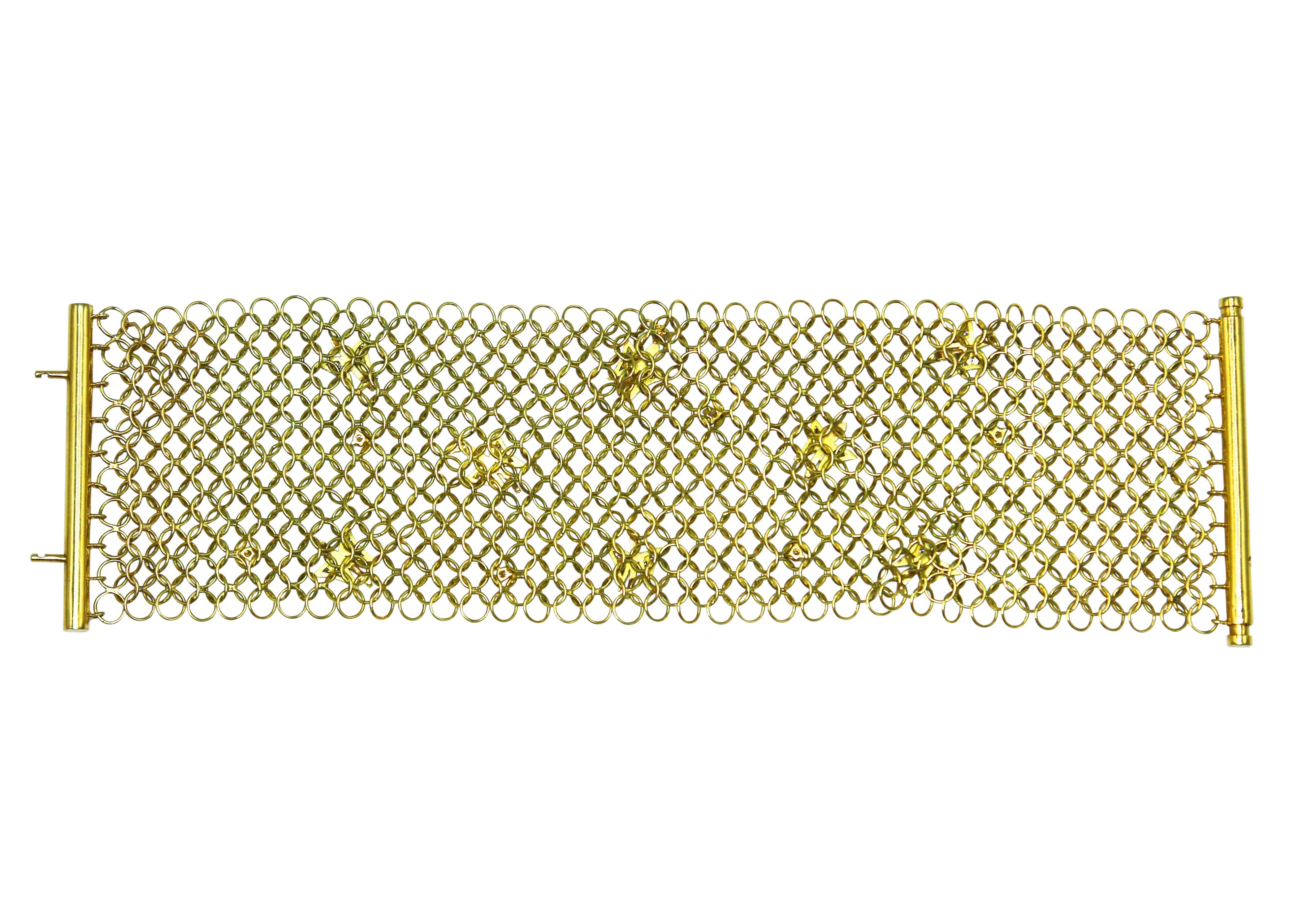 18 karat gold and diamond mesh link bracelet, Italy, the wide articulated gold link mesh strap accented by a scene of meandering butterflies accented by round diamonds weighing approximately 0.40 carat, gross weight 48.3 grams, length 7 inches,