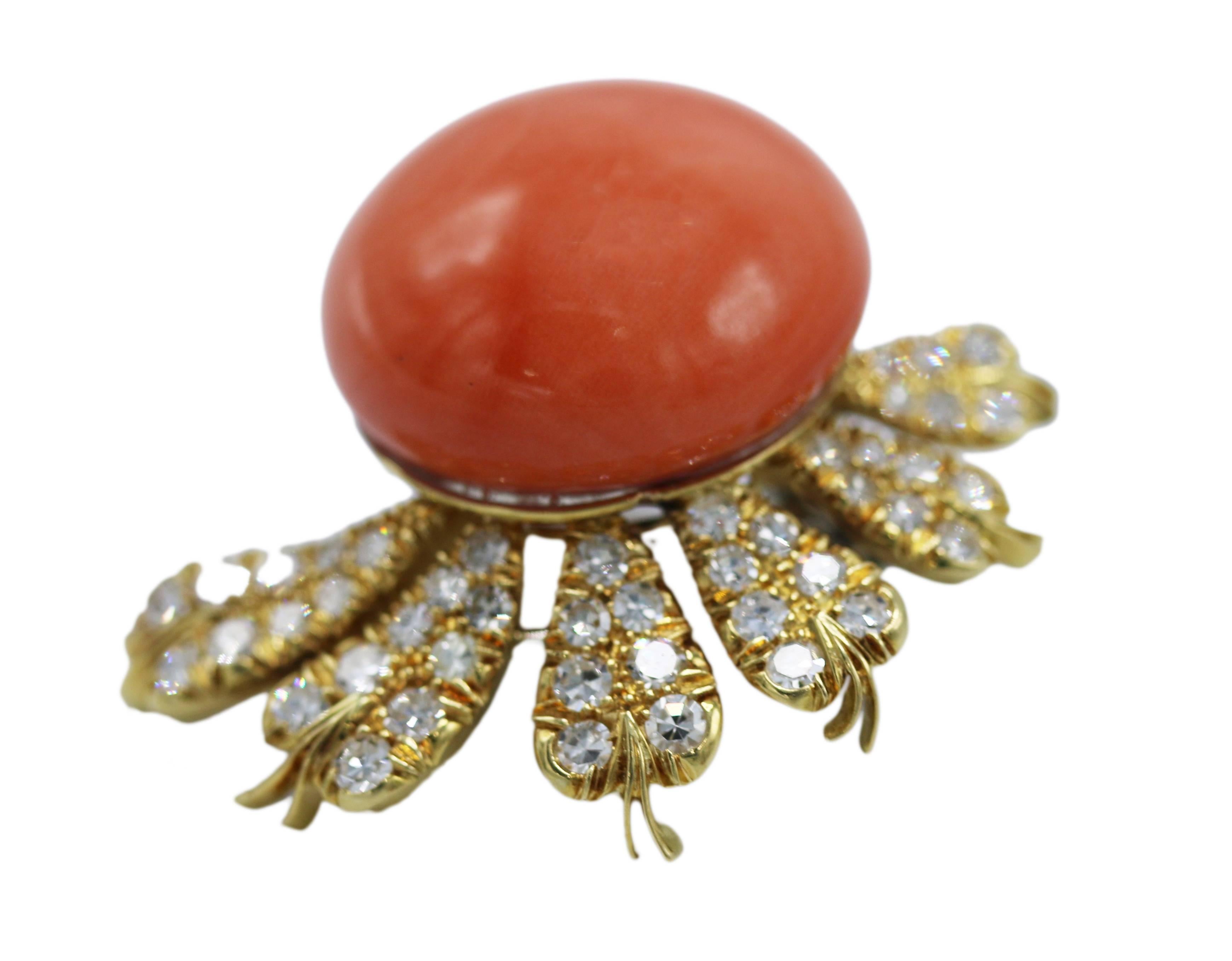 Pair of 18 karat yellow gold, natural coral and diamond earclips, Italy, featuring two round coral cabochons accented beautiful foliate inspired graduated leaves set with round diamonds weighing approximately 2.00 carats, gross weight 30.2 grams,