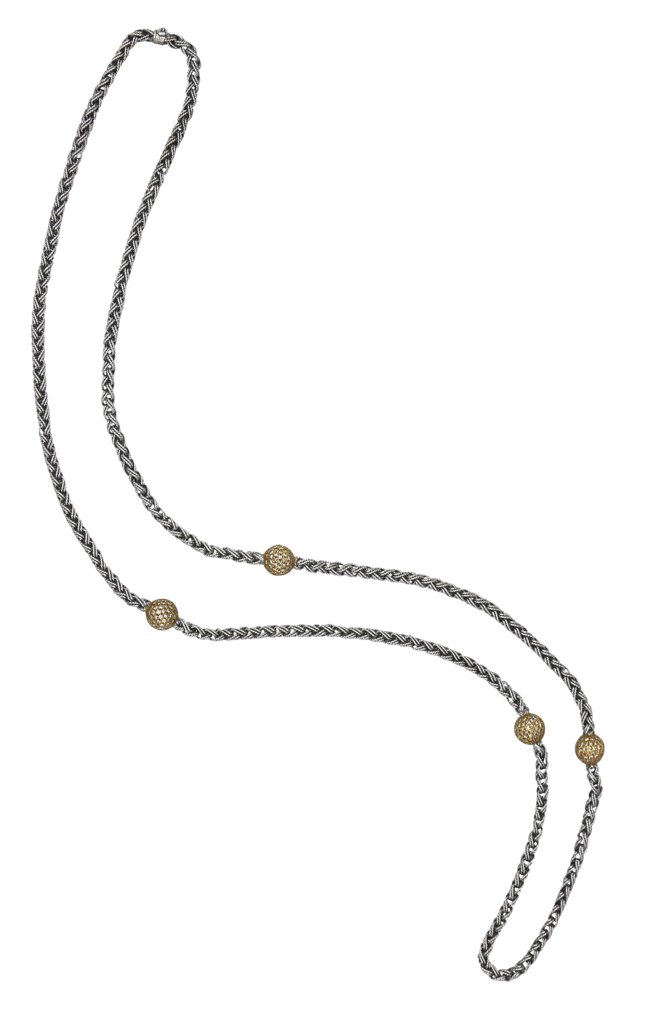 18 karat two-tone gold and diamond necklace, designed as a white gold longchain composed of a highly flexible circular chain spaced by yellow gold rondelles set with round diamonds weighing approximately 5.00 carats, gross weight 103.4 grams, length
