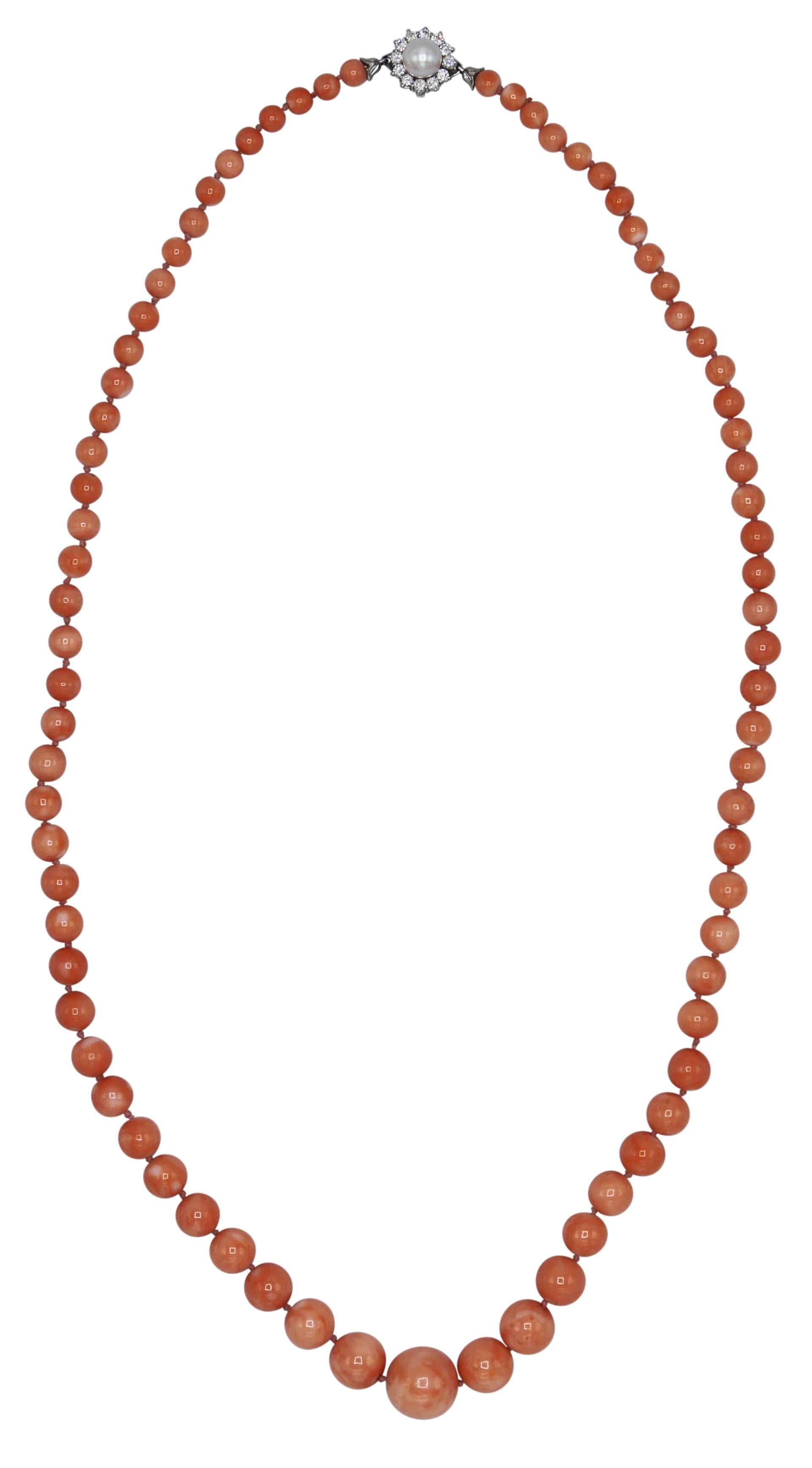 18 karat white gold, natural angel skin coral bead, pearl and diamond necklace, the single strand of graduated design composed of natural and untreated Japanese angel skin coral beads measuring 17.0 to 7.0 mm., completed by a clasp set with a