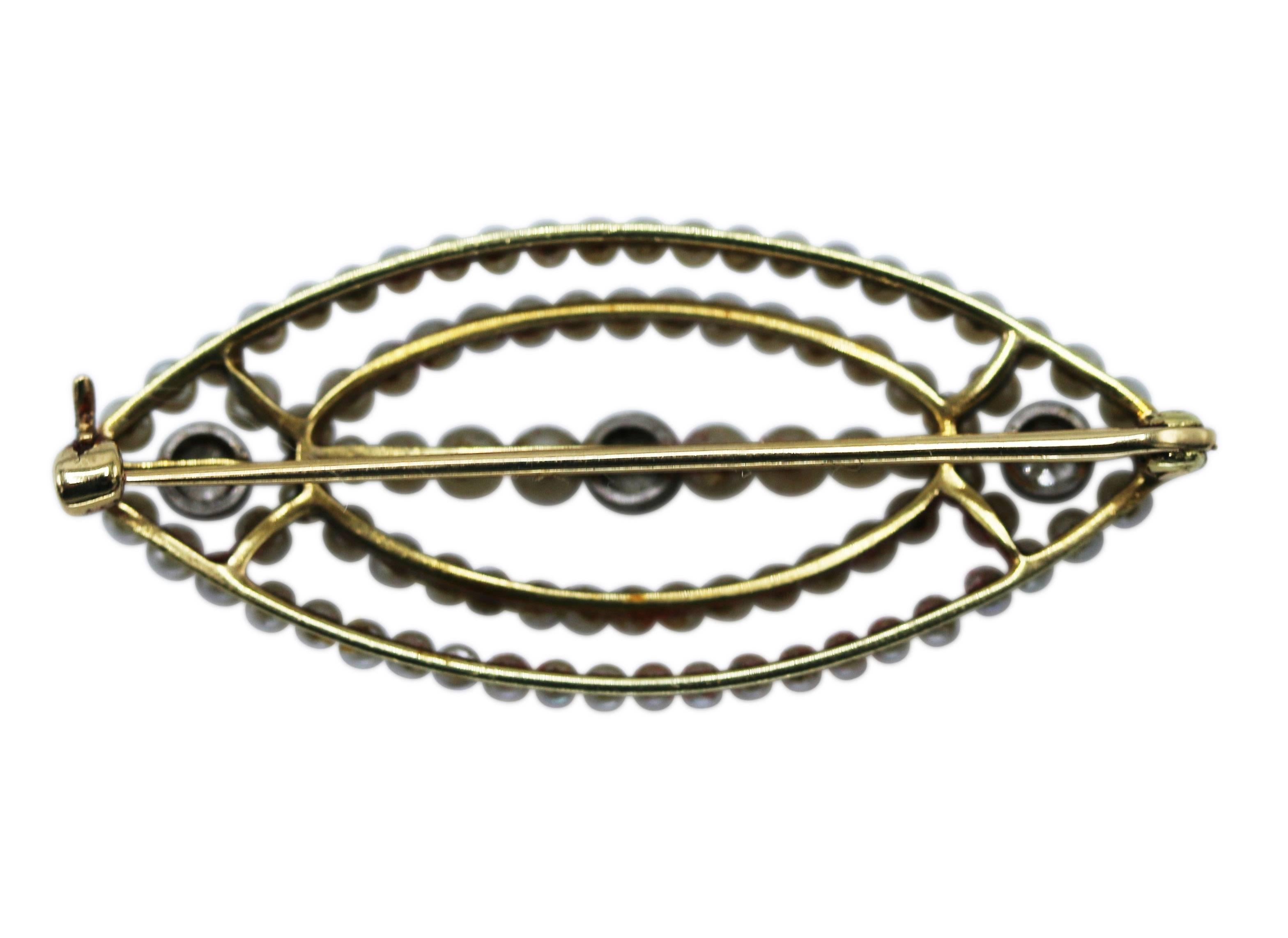 Early 20th Century gold, platinum, seed pearl and diamond brooch, the modified lozenge-shaped brooch of openwork design composed of lines of seed pearls measuring 1.8 to 2.5 mm., accented by old European-cut diamonds weighing approximately 0.15