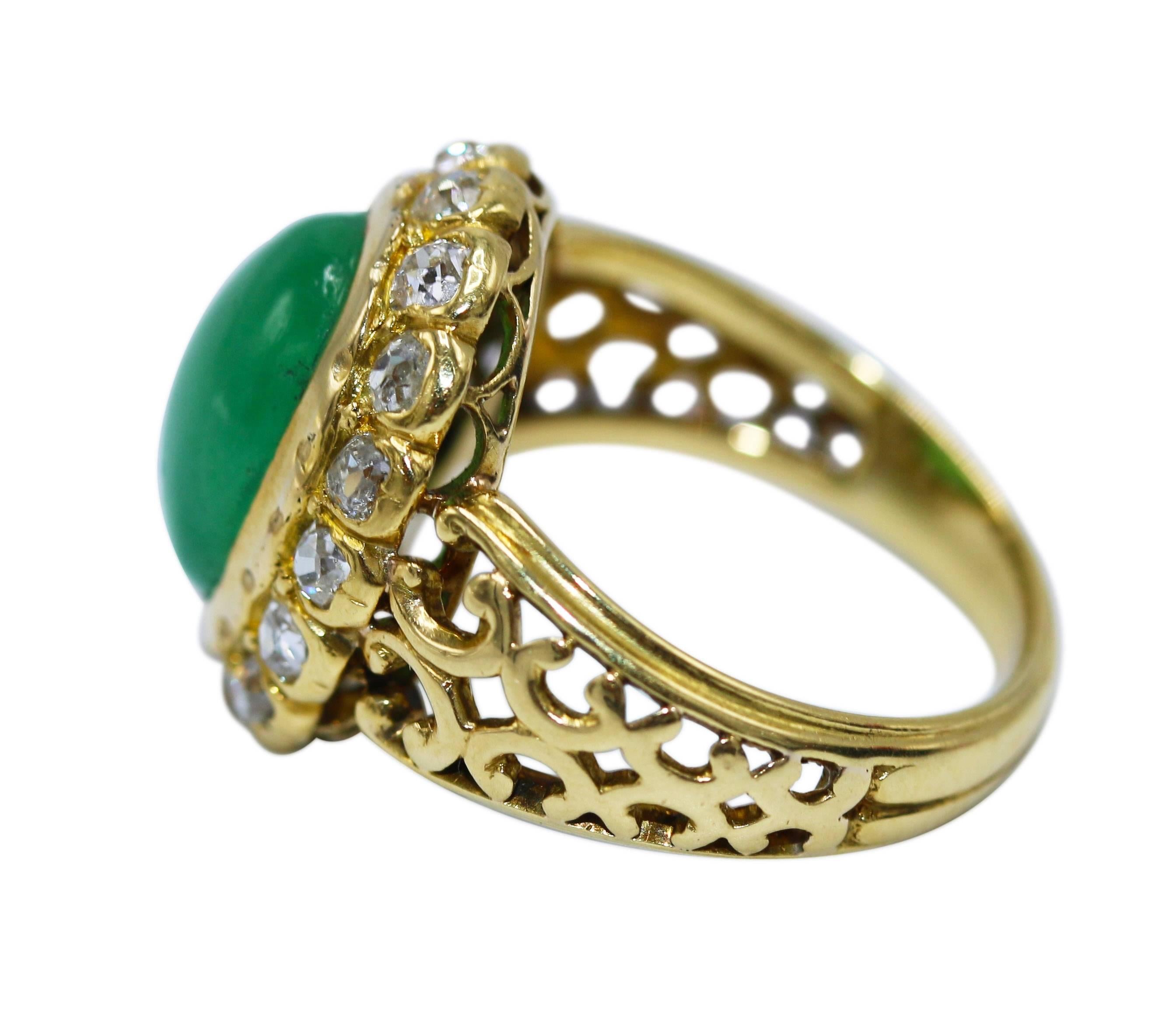 Victorian 18 karat yellow gold, jadeite and diamond ring, set in the center with a cabochon jadeite weighing approximately 5.75 carats, framed by old European-cut diamonds weighing approximately 0.90 carat, gross weight 7.1 grams, size 6.
Such a