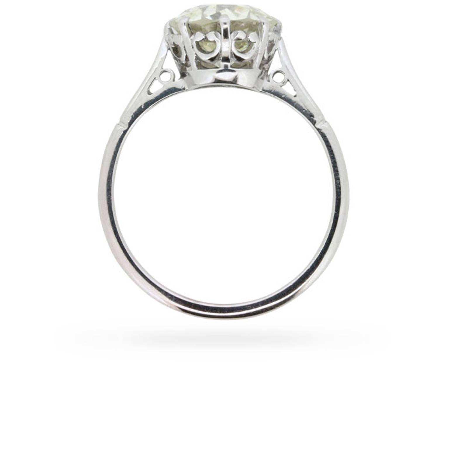 A gorgeous EDR certified, 2.39 carat, old European cut diamond is simply and elegantly presented in its original antique platinum mounting at the centre of this Edwardian era engagement ring.

Eight curving claws secure the diamond within a romantic