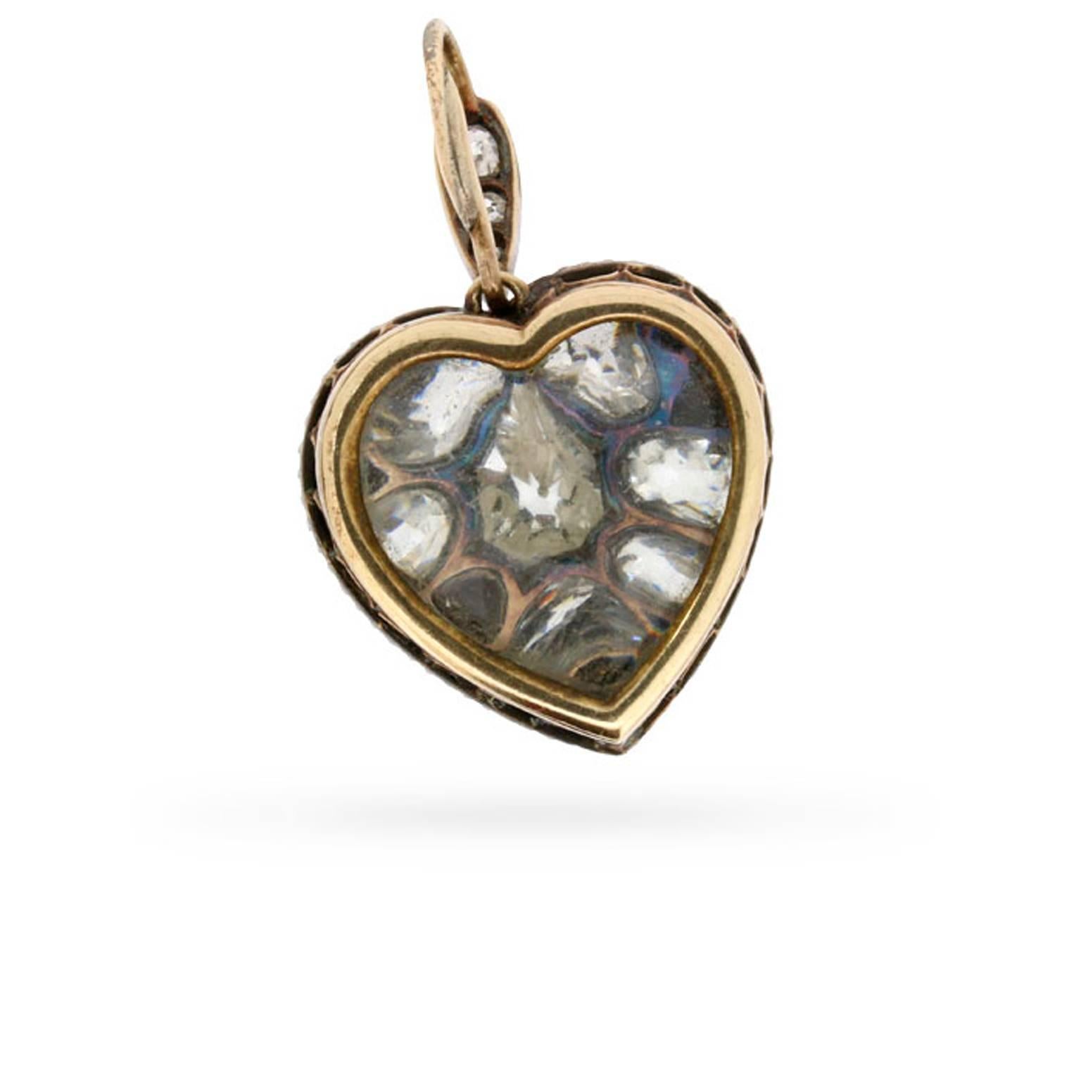 This rare and romantic heart-shaped locket was handmade in 18 carat yellow gold and silver over 125 years ago!

The circa 1880s locket is grain set with 3.60 carats of old cushion cut diamonds in graduated sizes with a lovely undulating gold border