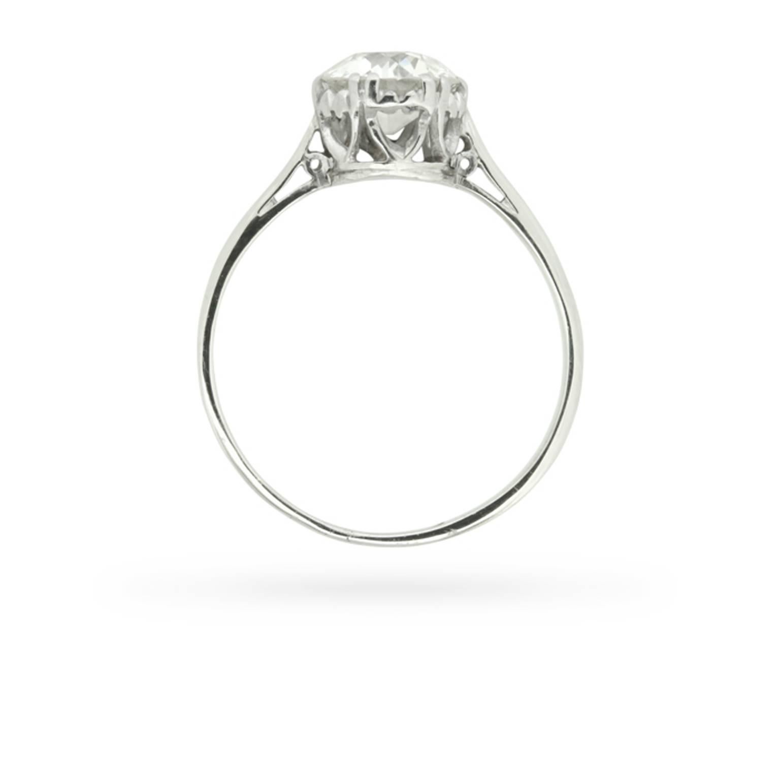 Exquisite in its simplicity, a 1.04 carat round old cut diamond is the solo performer in this circa 1910 diamond solitaire engagement ring. All handcrafted in platinum during the early years of the twentieth century, the ring’s split claws, openwork