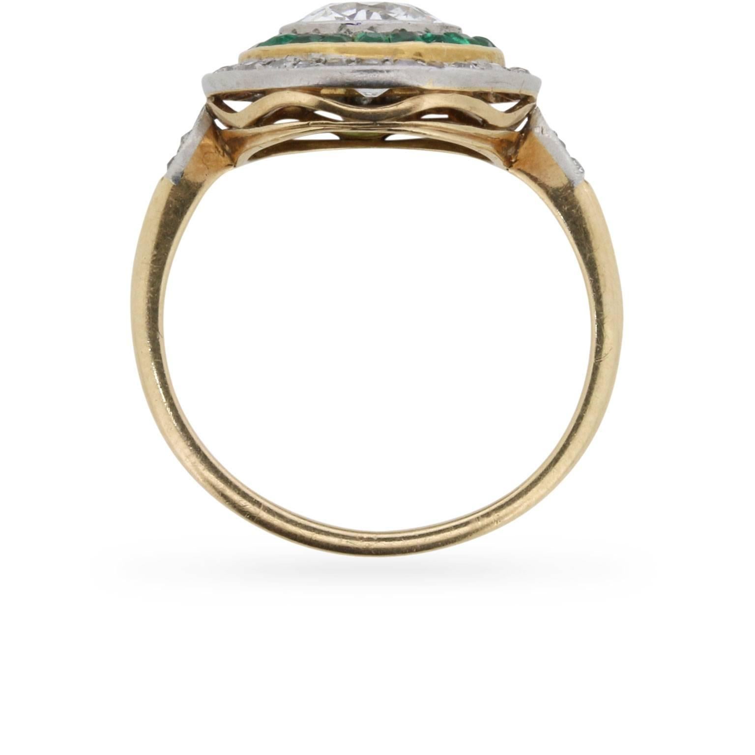 Handcrafted in 18 carat yellow gold and platinum during the 1890s, this wonderful example of a Victorian era target ring features an old cut diamond 'bullseye' with an approximate weight of 1.25 carats. The balance of the 'target' is comprised