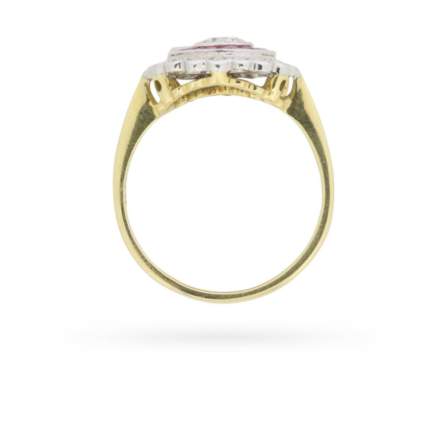 Old and eight cut diamonds, and a beautifully designed, handmade two-tone mounting might lead you to believe that this 1950s era diamond and ruby target ring is much older than its age. The ring’s round old cut diamond ‘bullseye’ is framed