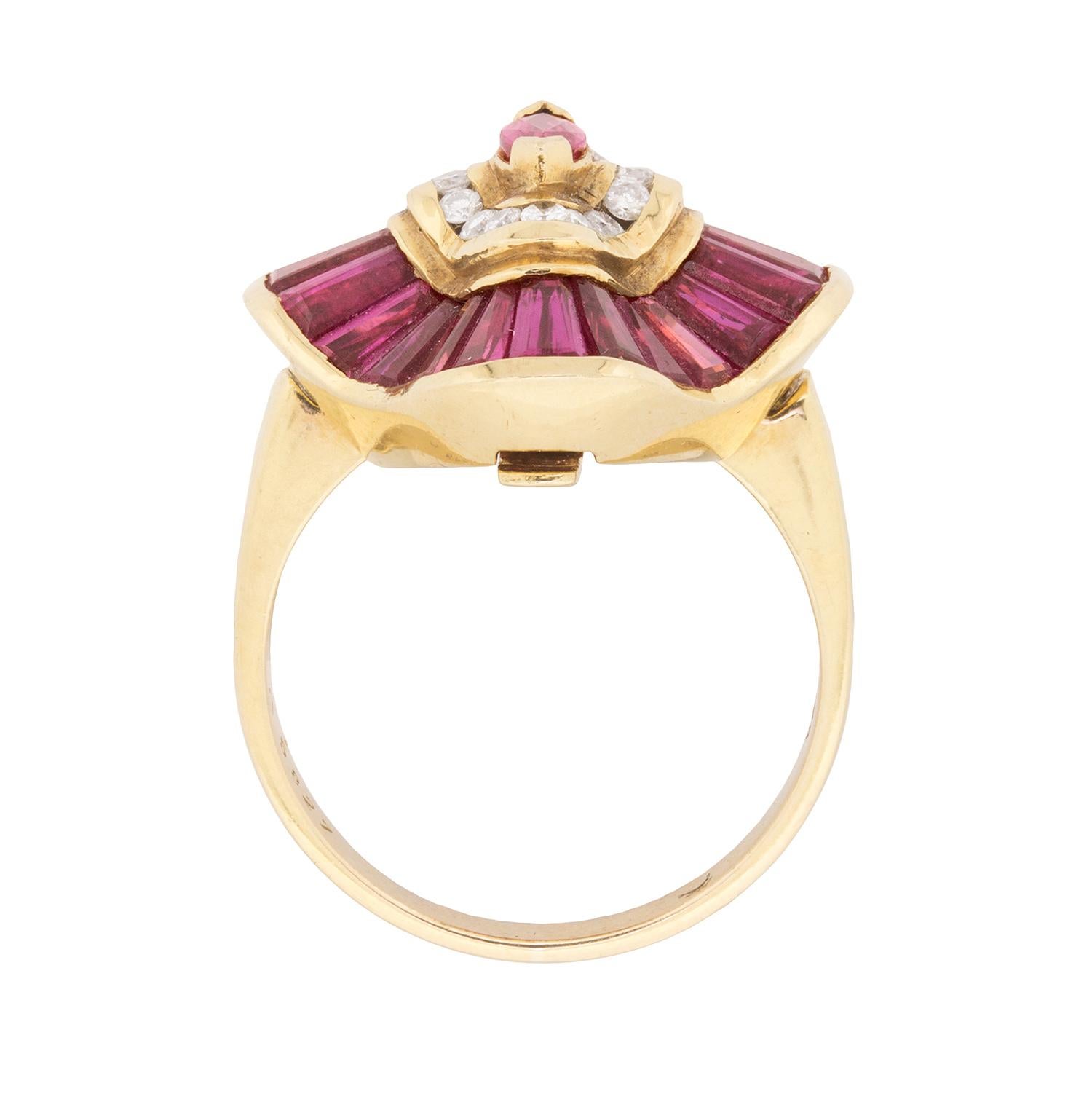 This sensational circa 1970s ruby and diamond cocktail ring converts to a pendant!

This unusual piece centres one marquise-shaped ruby vertically set with French tips inside a concentric channel set row of 0.16ct round brilliant cut diamonds, and a