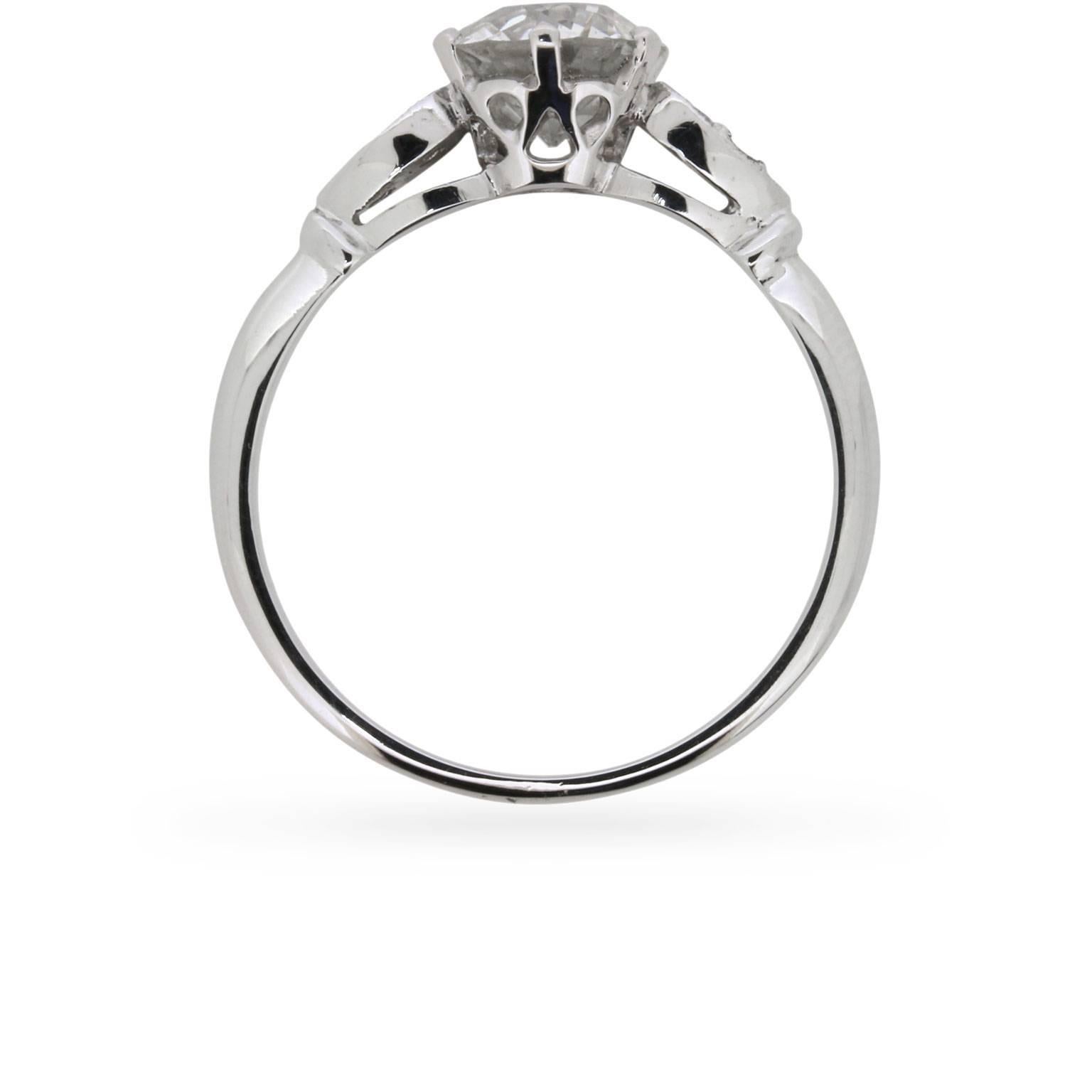 A stunning solitaire ring with eight cuts either side to highlight. The centre stone is 1.22 carat with a colour grade of H and clarity of SI3. The eight cuts total 0.06 carat and are grain set, which compliments the claw set centre stone.

The