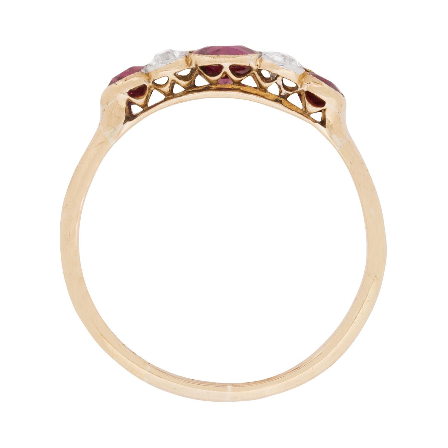 This classic late Victorian era ‘five stone’ ring features a colourful trio of old cut rubies interspersed with pairs of old cut diamonds, all set in rubover mountings with millegrain edging.

Handmade around the turn of the twentieth century, this