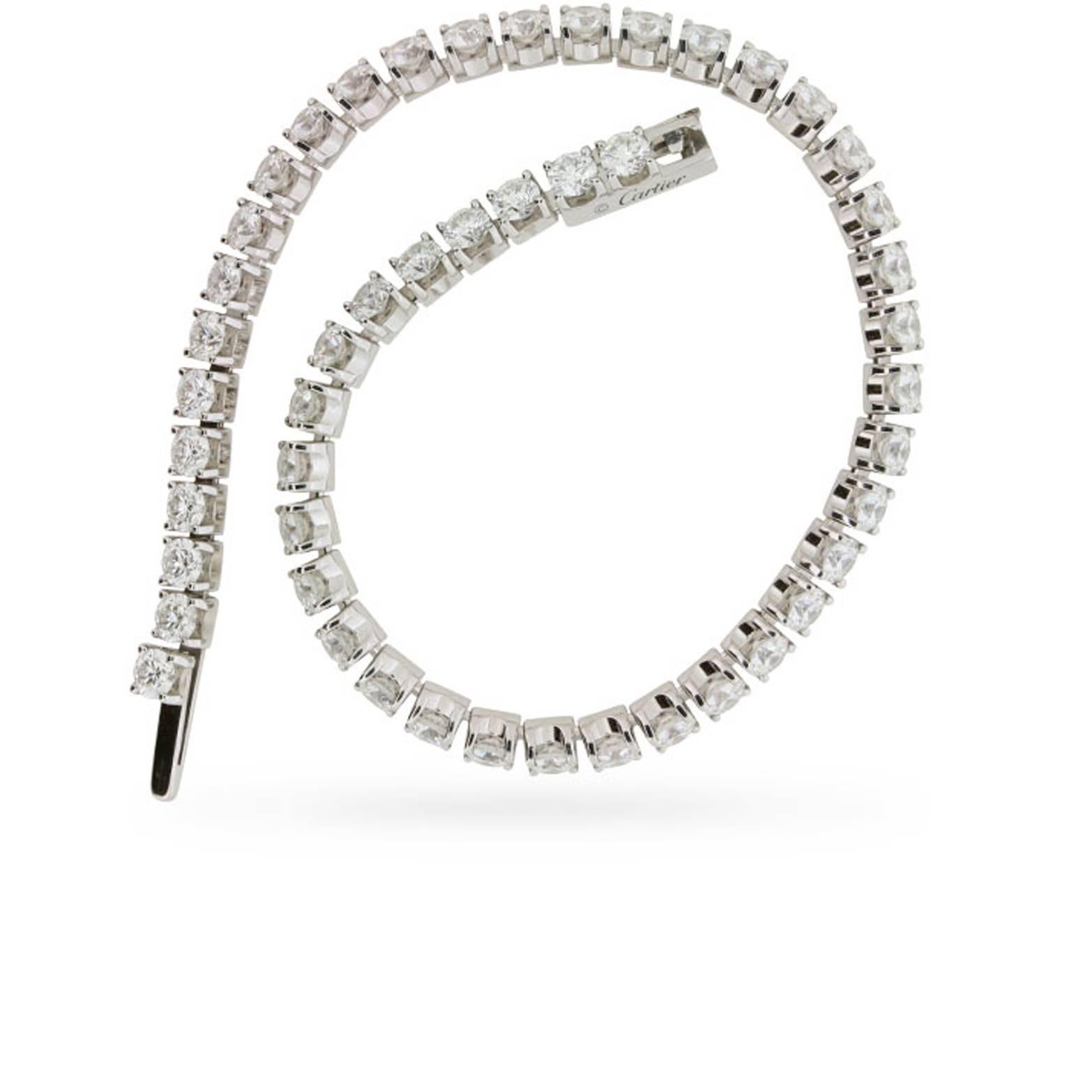 This stunning  Cartier ‘Essential Lines’ tennis bracelet is hand-set in 18 carat white gold with 4.68 carats of round brilliant cut diamonds. These 52 Cartier diamonds are graded F colour and VS clarity, and they’re as fiery as you’d expect coming