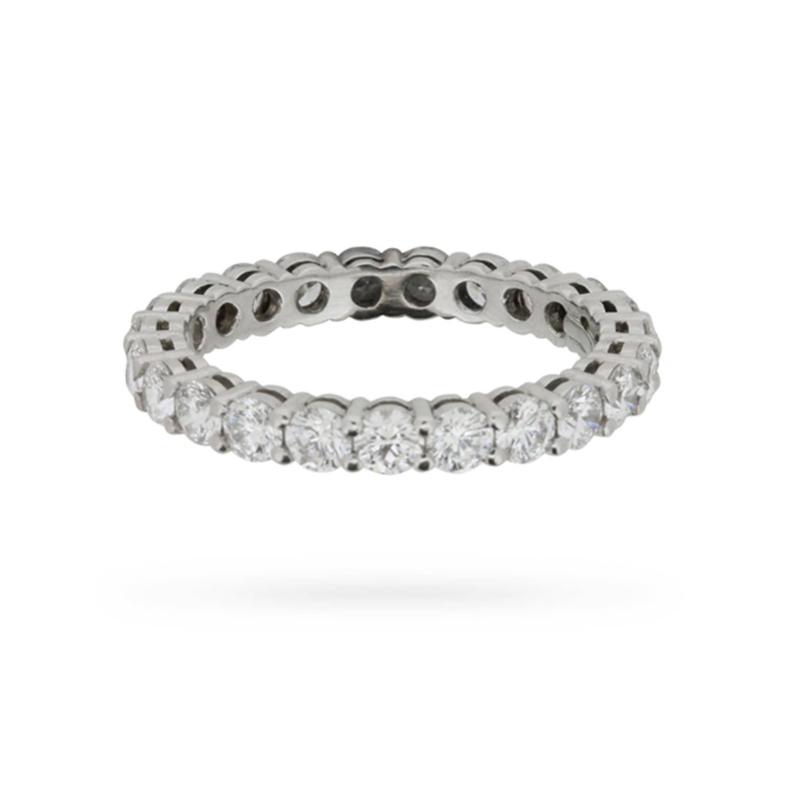 This classic Tiffany & Co. eternity ring is set full circle with exquisite E colour, VVS clarity, round brilliant cut diamonds totalling 1.87 carats.

The diamonds are hand-set in shared claw mountings fashioned in beautiful and durable platinum.