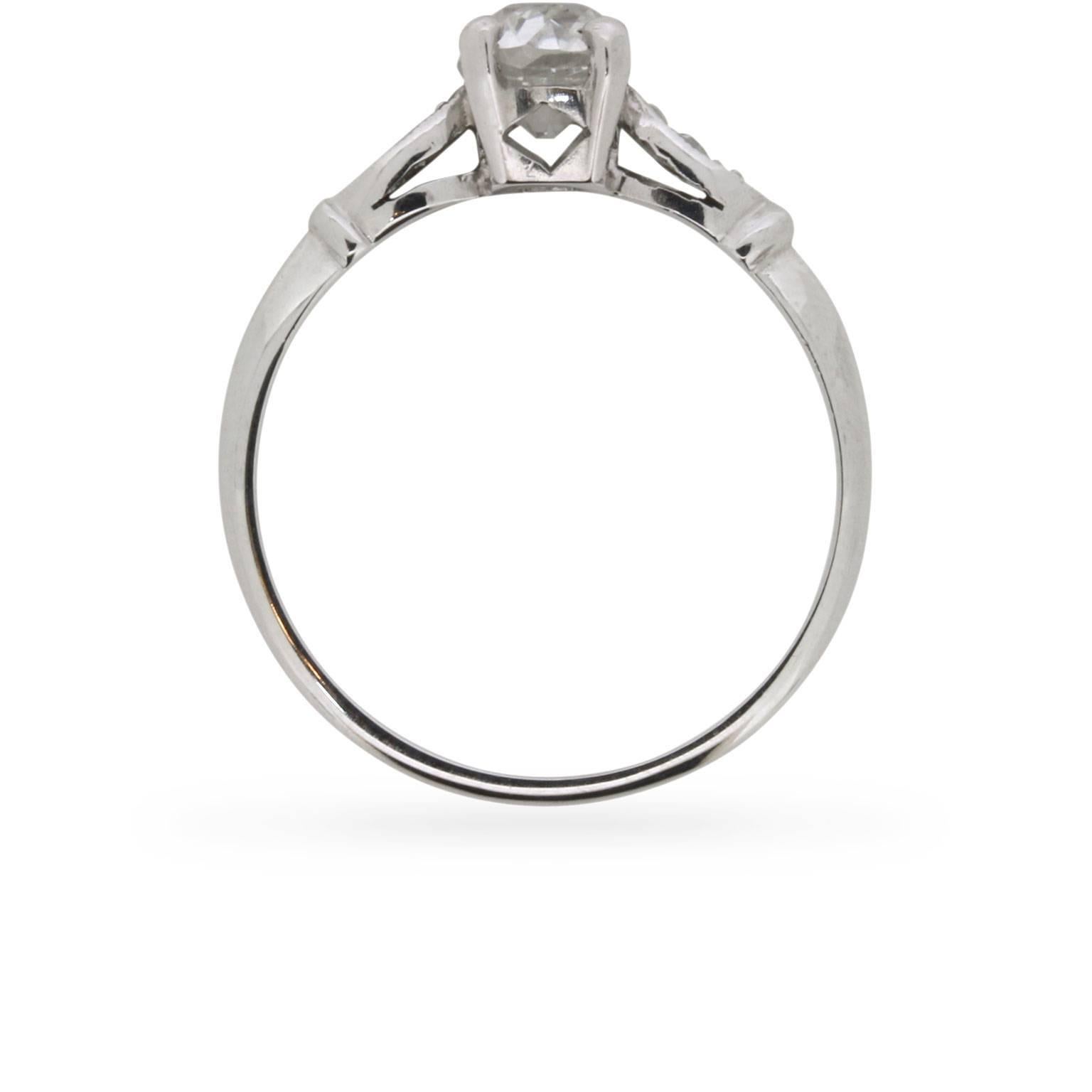 This is a delicate little ring, with a beautiful old cut oval stone in the centre. It has a weight of 0.80 carat and is grade colour G and clarity SI1. The certification is from EDR. The stone is then wonderfully set in the platinum mount using