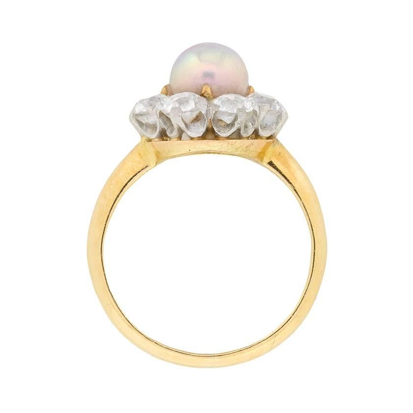 This delicate and ornate cluster ring has a lovely pearl centre stage. It measures 5.9mm and has been tested as a natural pearl, saltwater. It has a wonderful symmetry and colour which is expertly highlight by the cluster of old cut diamonds